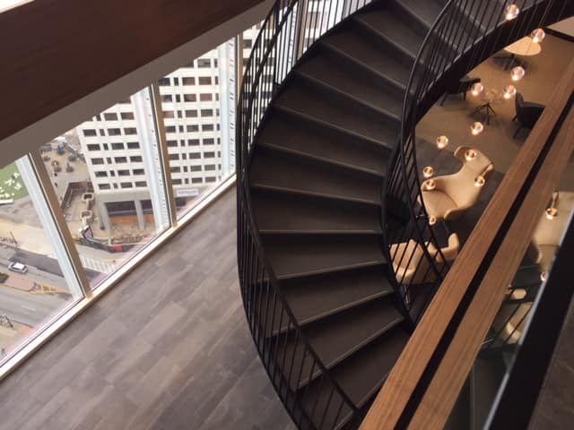 1180 Peachtree Spiral Staircase and glass upper wall.