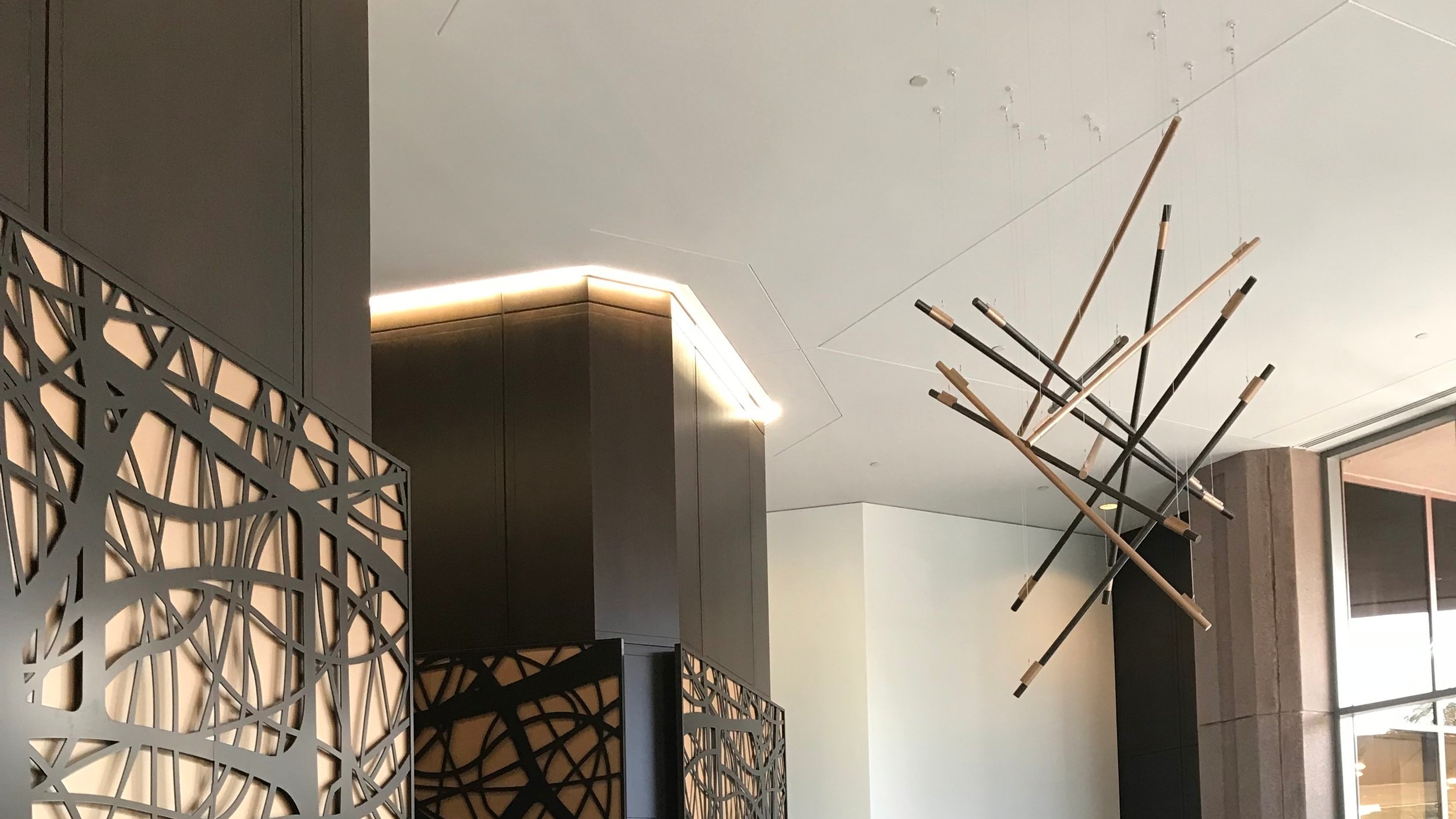 Peidmont 14 - Fabricated and installed isometric brass and wood sculpture