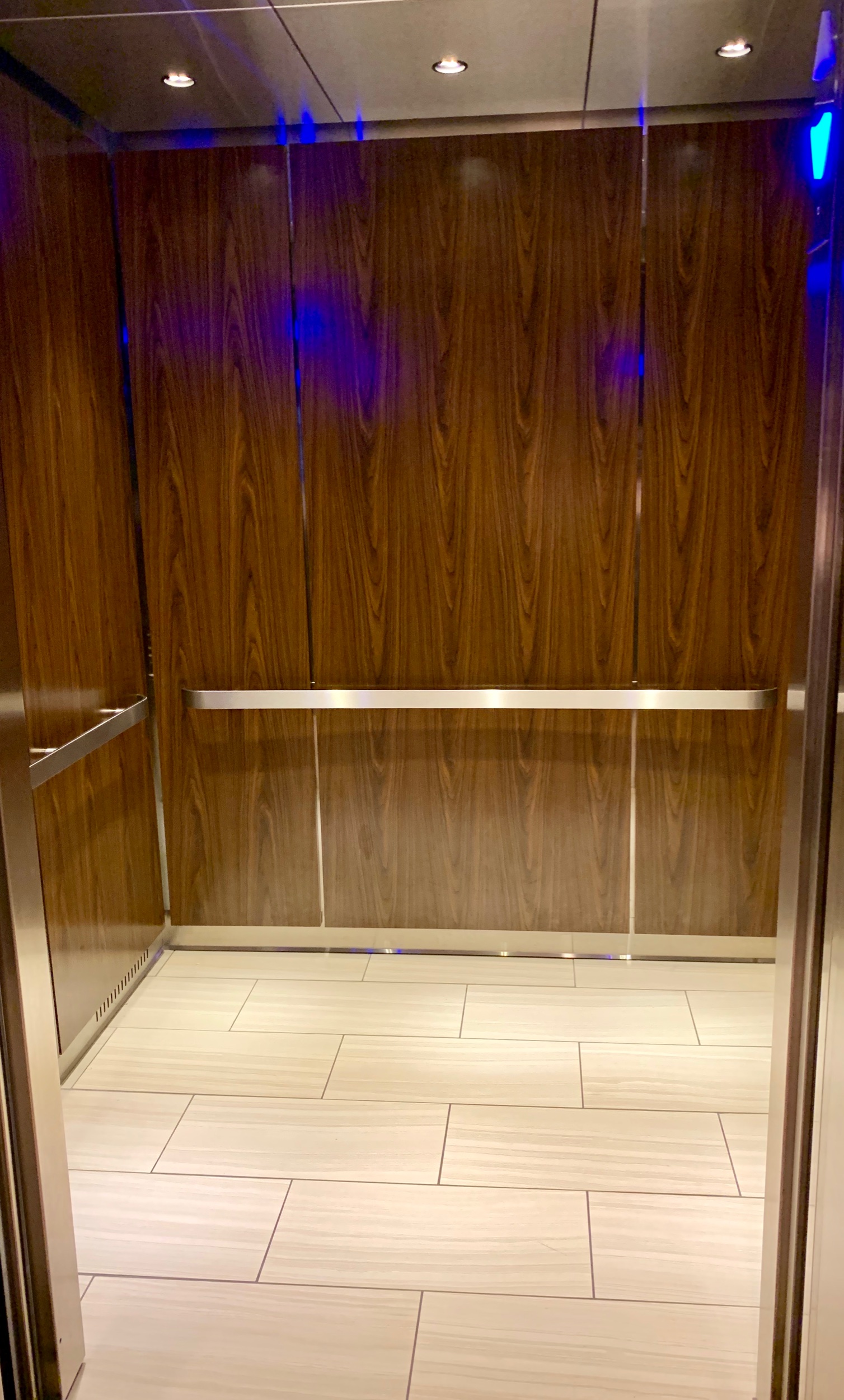 Crown Plaza Atlanta Perimeter at Ravina - Fabricated and installed brushed stainless steel ceiling, reveals and handrails, laminate wall panels with tile flooring.