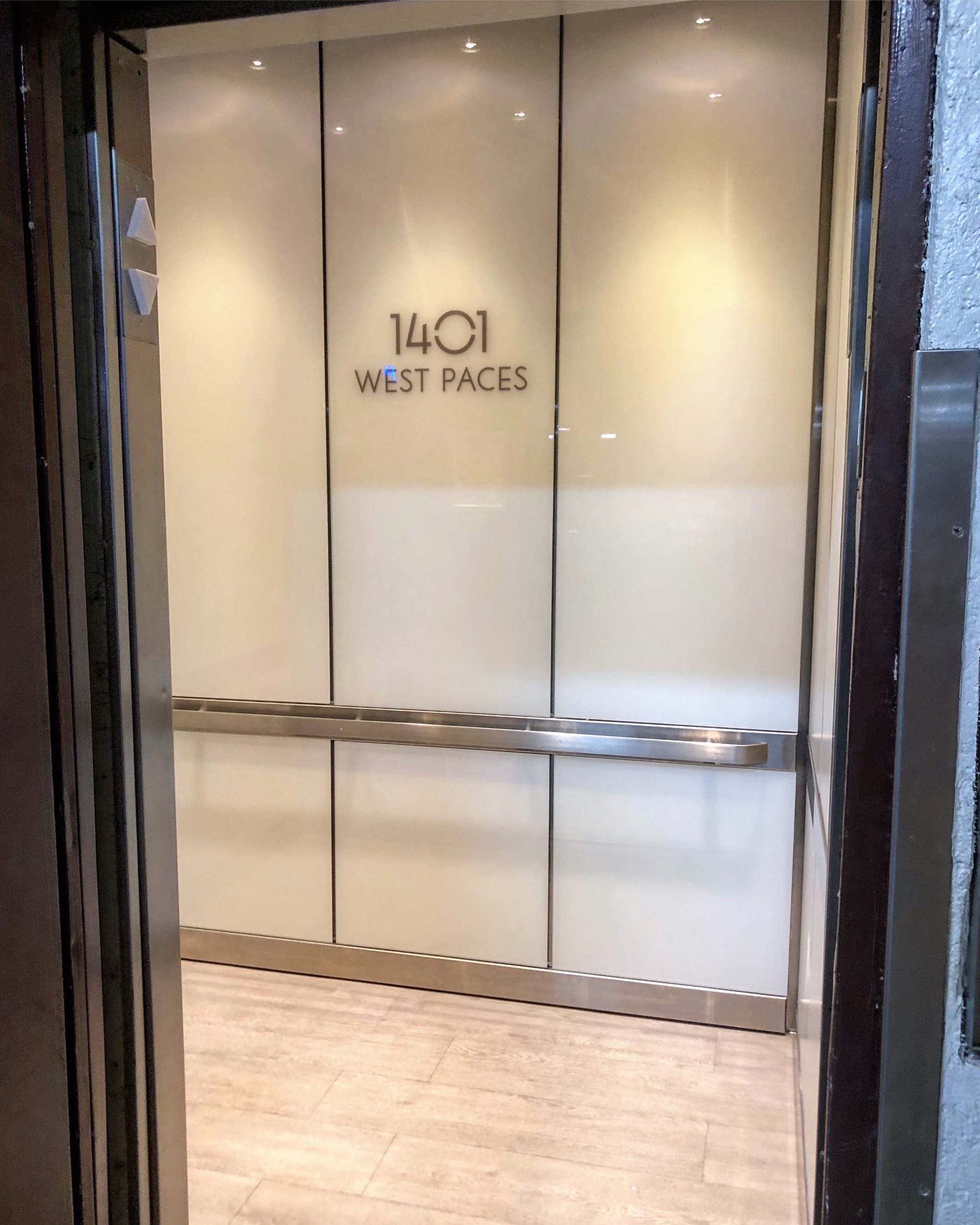 Reserve at West Paces - Installed brushed stainless steel ceiling, hand rails, reveals. Installed etched glass panels on back wall and laminate panels on side walls. Installed laminate vinyl floor
