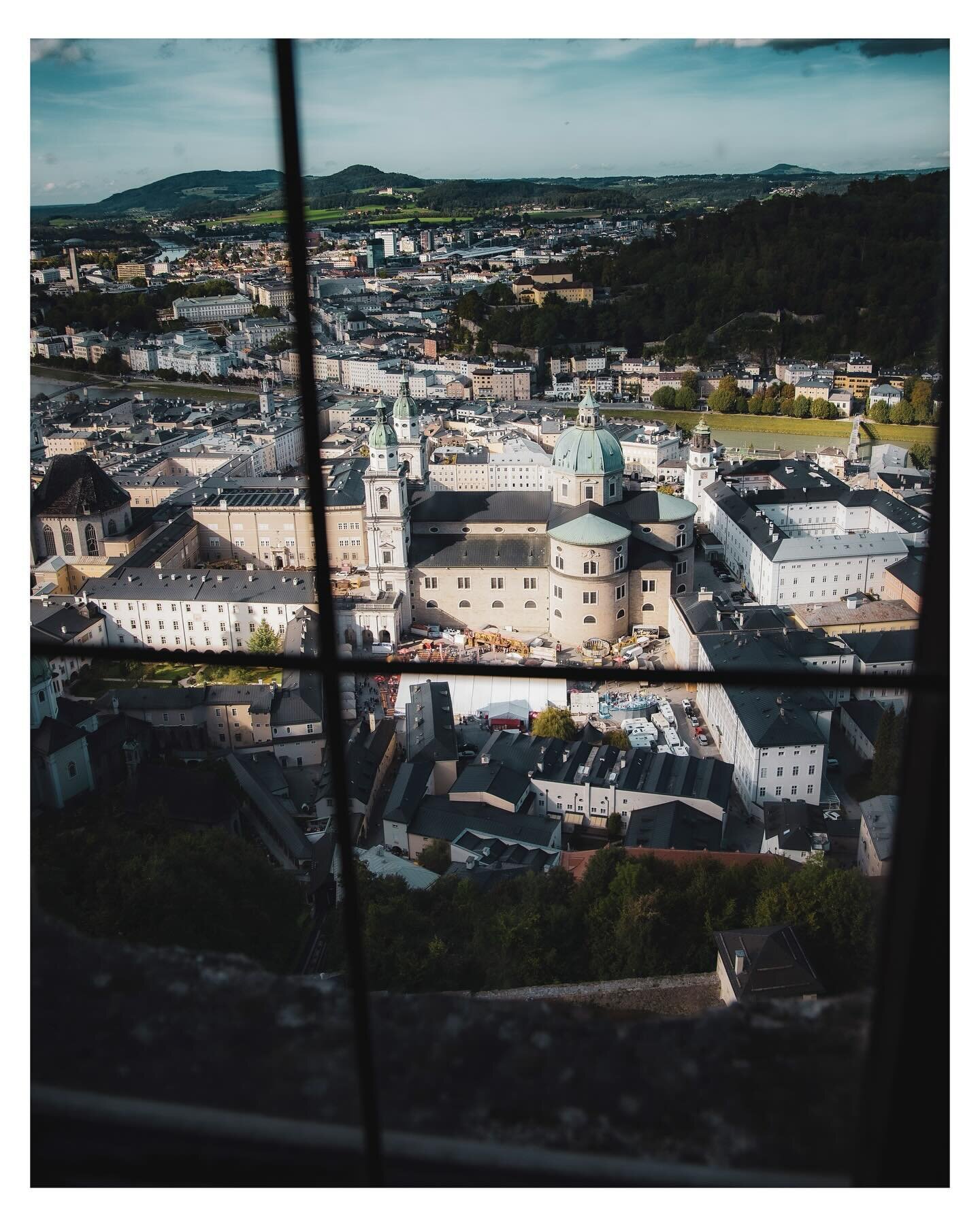 The sun-glowing cathedral in Salzburg, seen from one of the many windows of the Fortress Hohensalzburg.

The Salzburg Cathedral (German: Salzburger Dom) is the seventeenth-century Baroque cathedral of the Roman Catholic Archdiocese of Salzburg in the