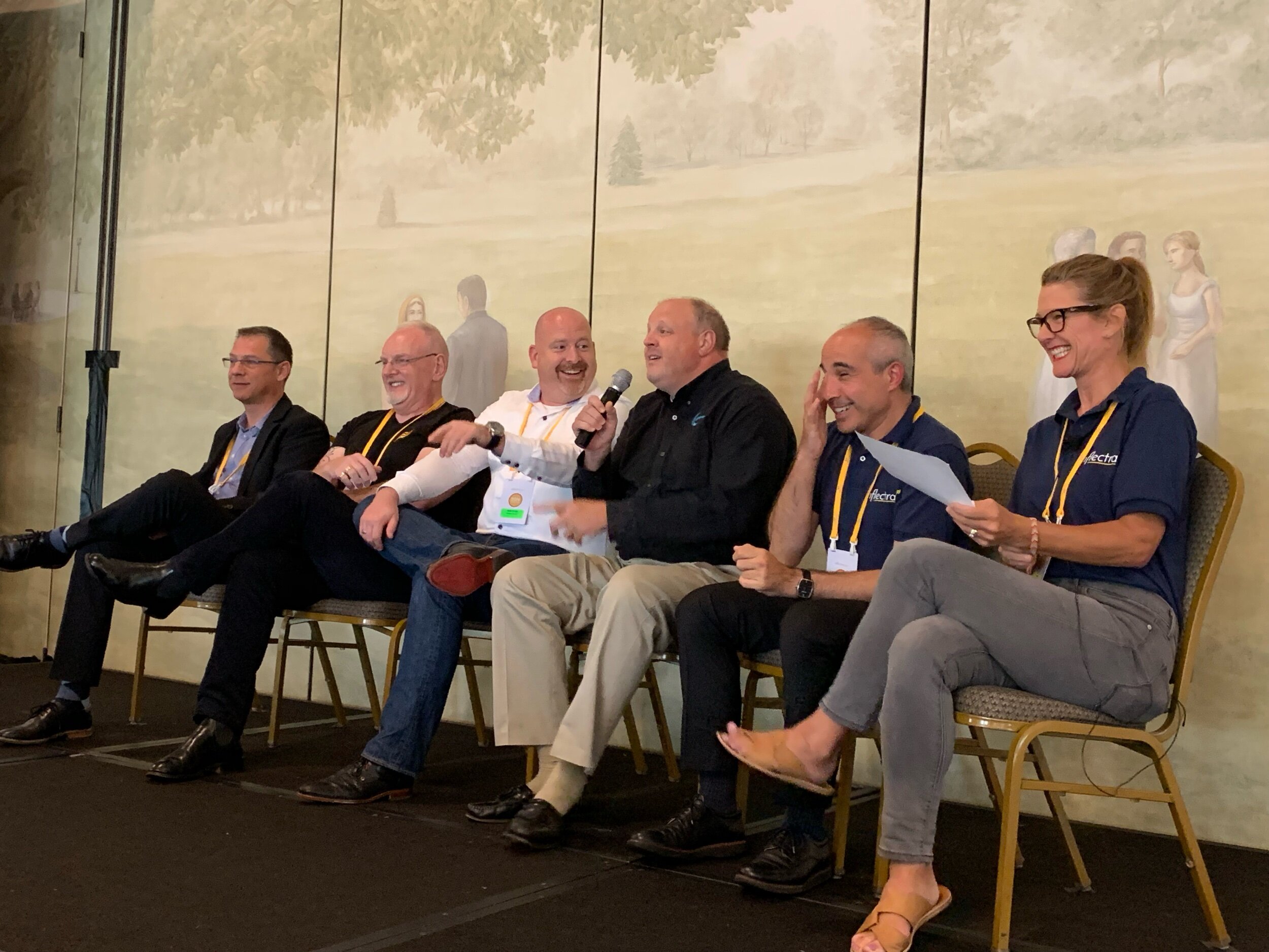 Andreas Eckerle (Generali Insurance), Peter Brackstone (Influence IT Consulting Pty. Ltd.), Remco Putker (Robust-IT), Jeffery Payne (Coveros), Adam Sandman (Inflectra), and Jessica Moore (Inflectra) discussing topics at InflectraCon 2019, Cincinnati, OH, USA.