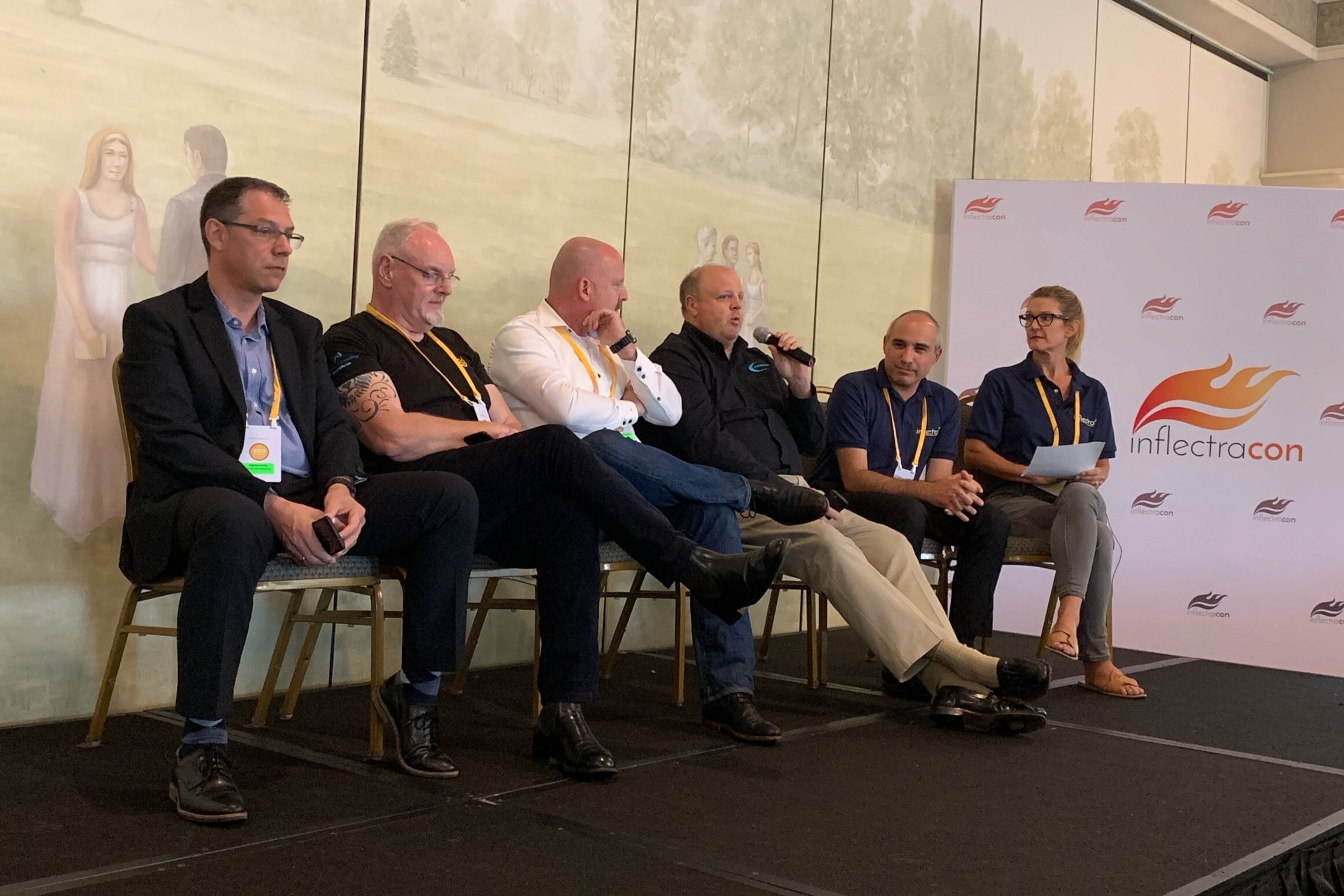Andreas Eckerle (Generali Insurance), Peter Brackstone (Influence IT Consulting Pty. Ltd.), Remco Putker (Robust-IT), Jeffery Payne (Coveros), Adam Sandman (Inflectra), and Jessica Moore (Inflectra) discussing topics at InflectraCon 2019, Cincinnati, OH, USA.