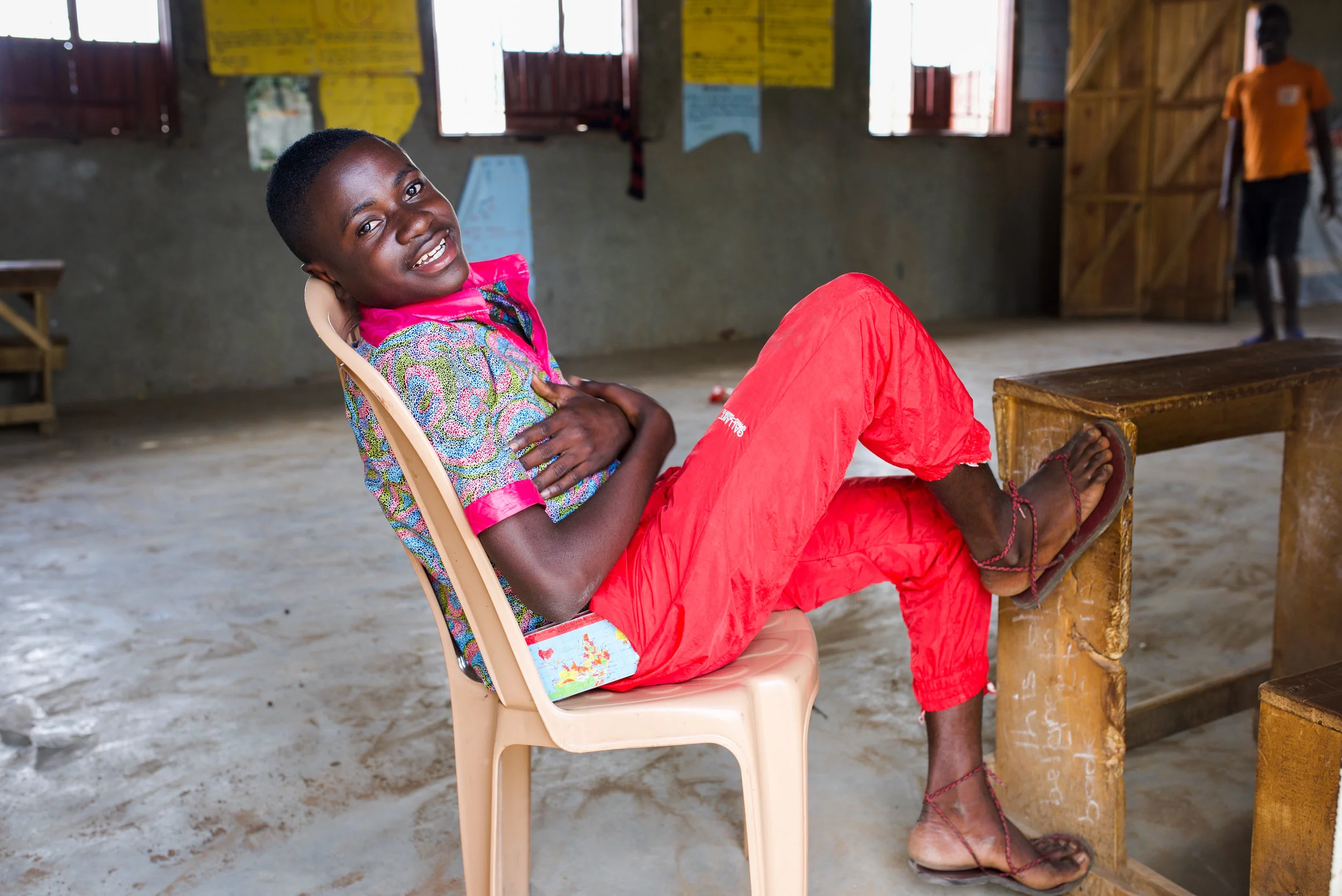 Gilbert, 14, P7. Chillin in his classroom after the school day had ended.