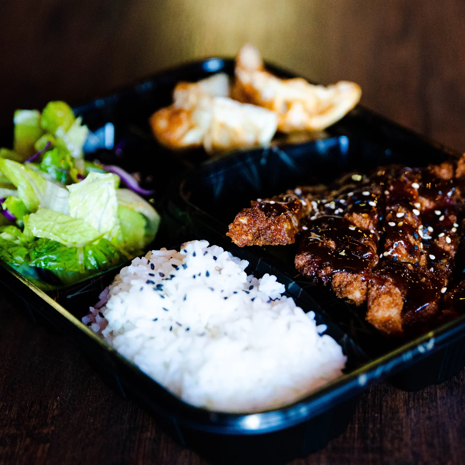 Asian fusion entree served with rice and sides