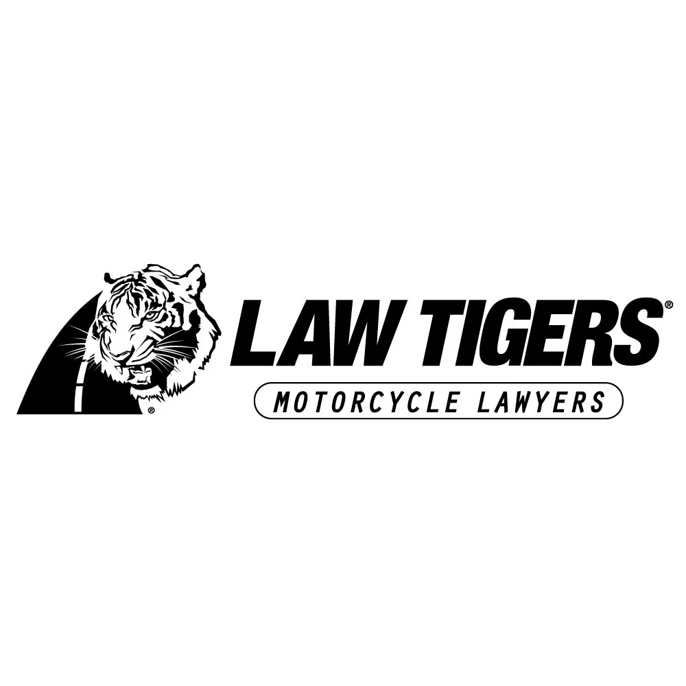 Logo for Law Tigers Motorcycle Lawyers featuring a tiger face and bold text.