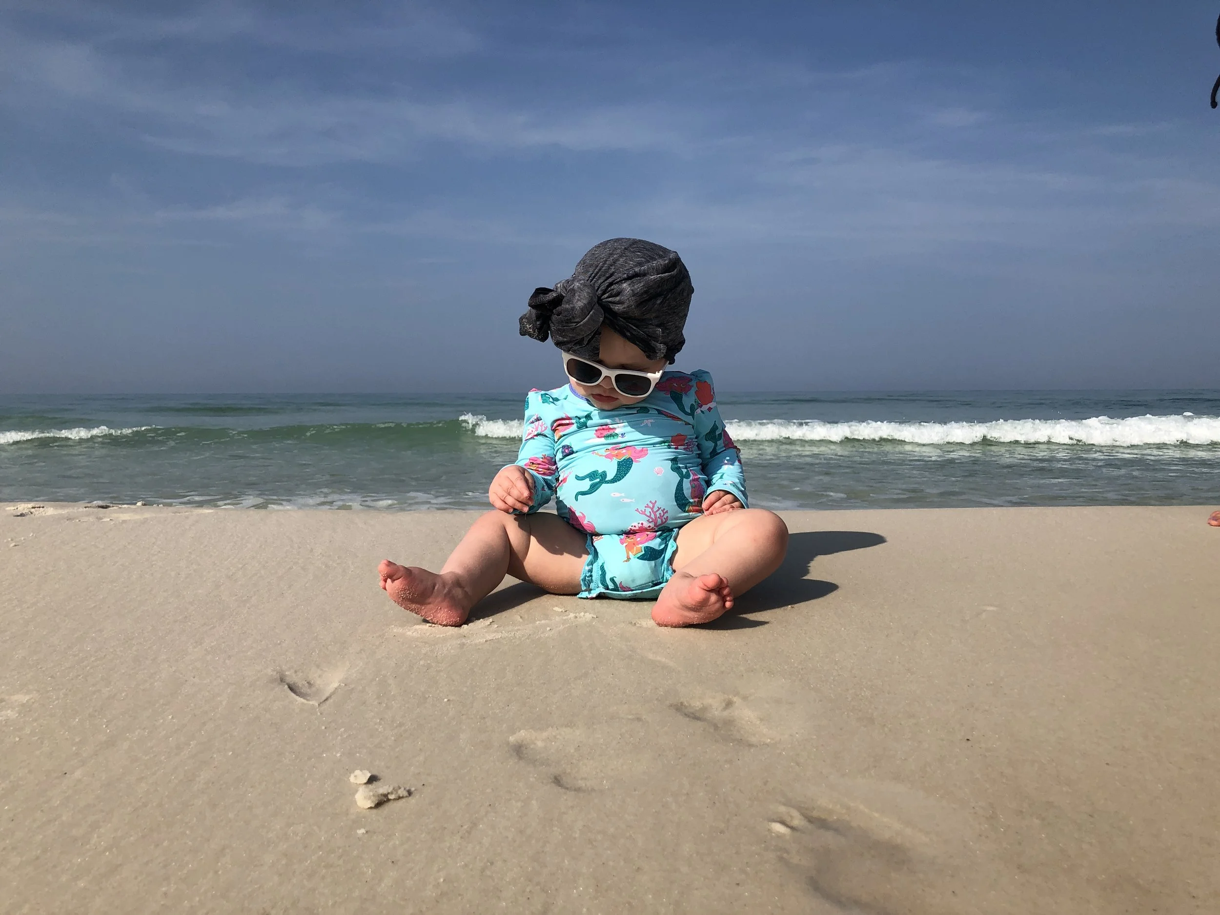 Why Sunglasses Are Just as Important as Sunblock and Seatbelts for Your Child's Health