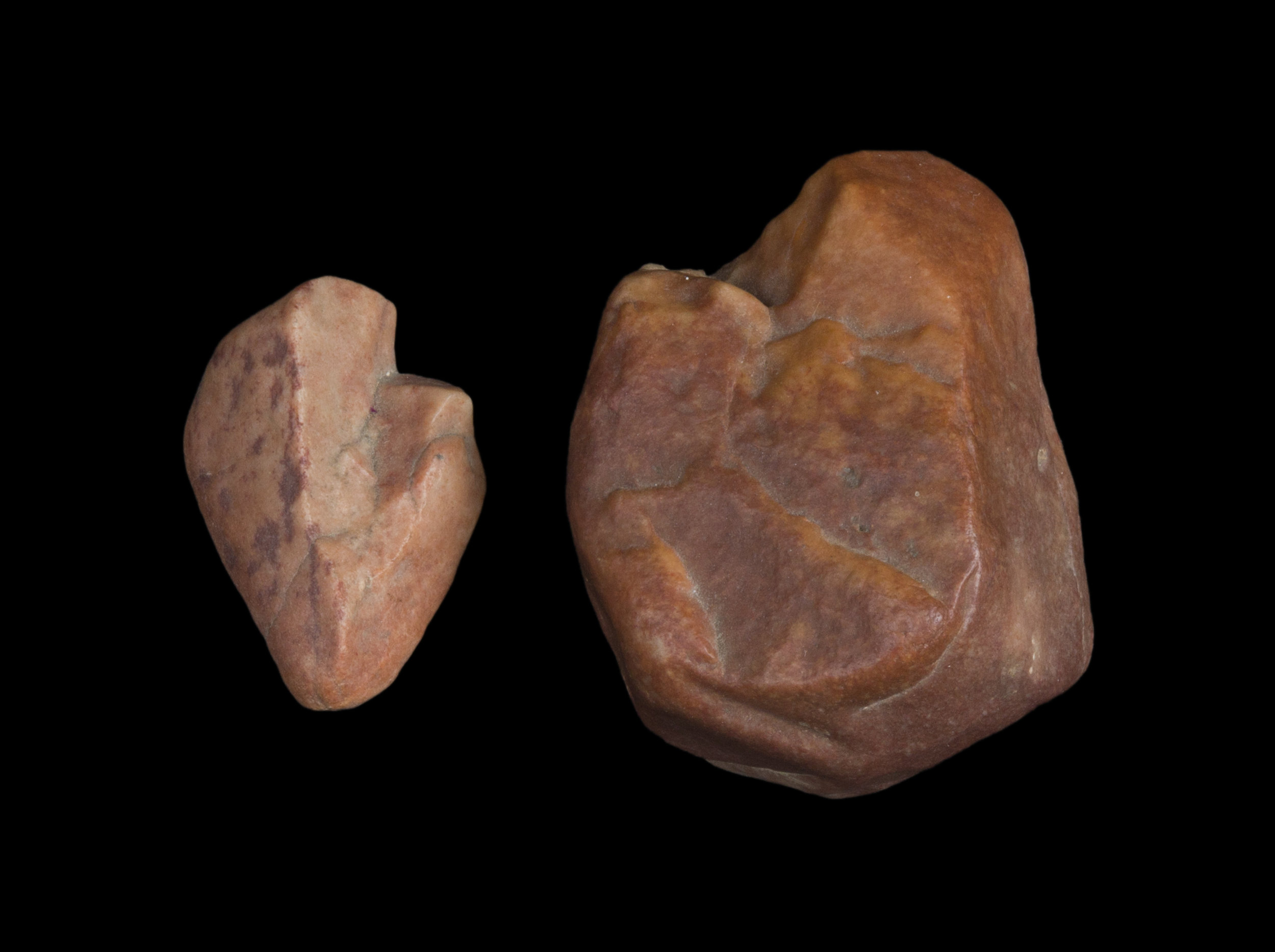  Two roughly heart shaped rocks dappled in warm orange tones.    Two rock hearts that changed my life that were found at Dharma Dena meditation Retreat in Palm Springs.  After  Three days of silent meditation, I found these rocks and I knew I needed 