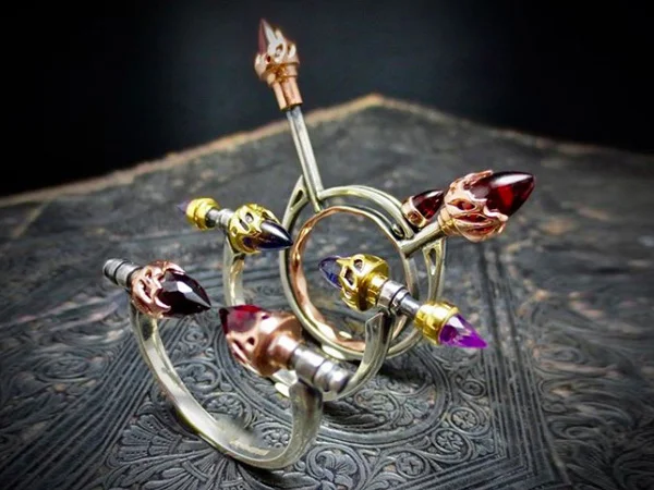 ‘Beastiola’ limited edition kinetic rings in Iolite, Amethyst and Garnetby Odette