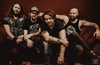 Royal Bliss band members (left to right): Taylor Richards (guitar), Brian Hennesy (bass), Neal Middleton (lead vocals), and Jake Smith (drums).