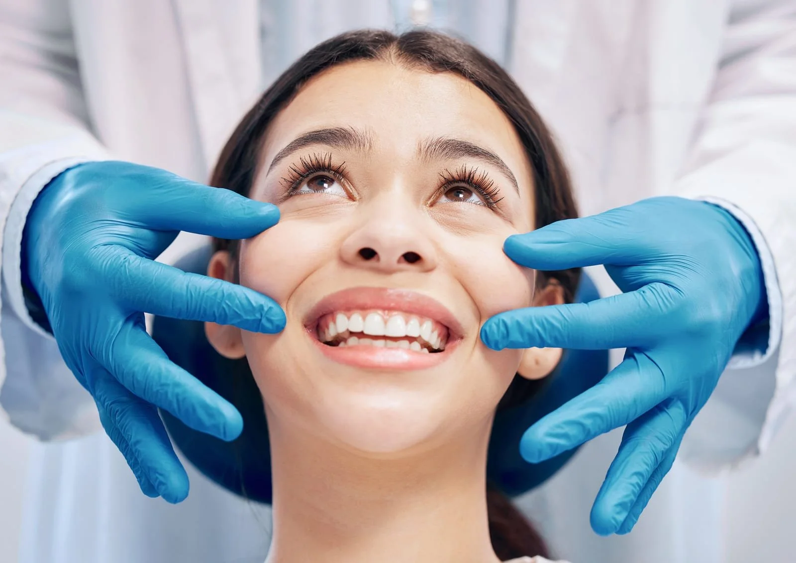 woman getting a consultation before her teeth whitening treatment session