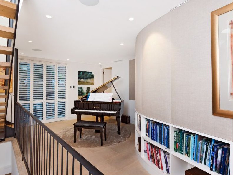  Piano room with built in bookcases 