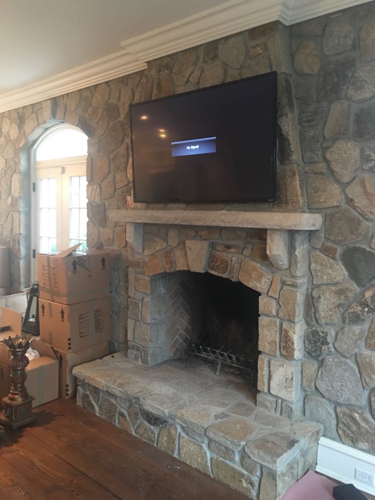 TV installation above fireplace.jpg