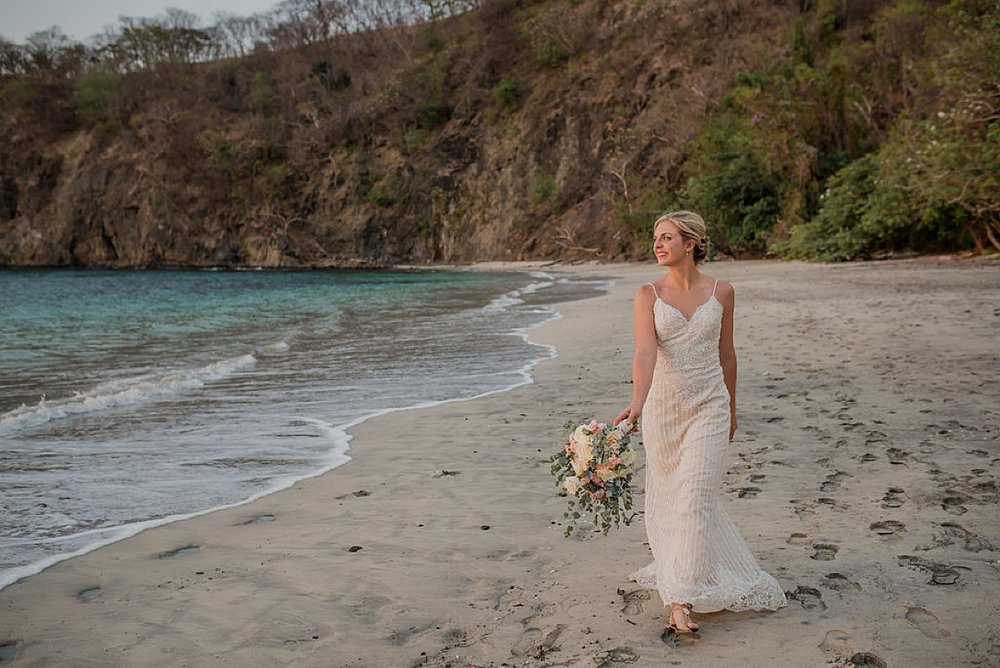 Bride walking on beach Four Seasons Costa Rica.jpg.jpg
