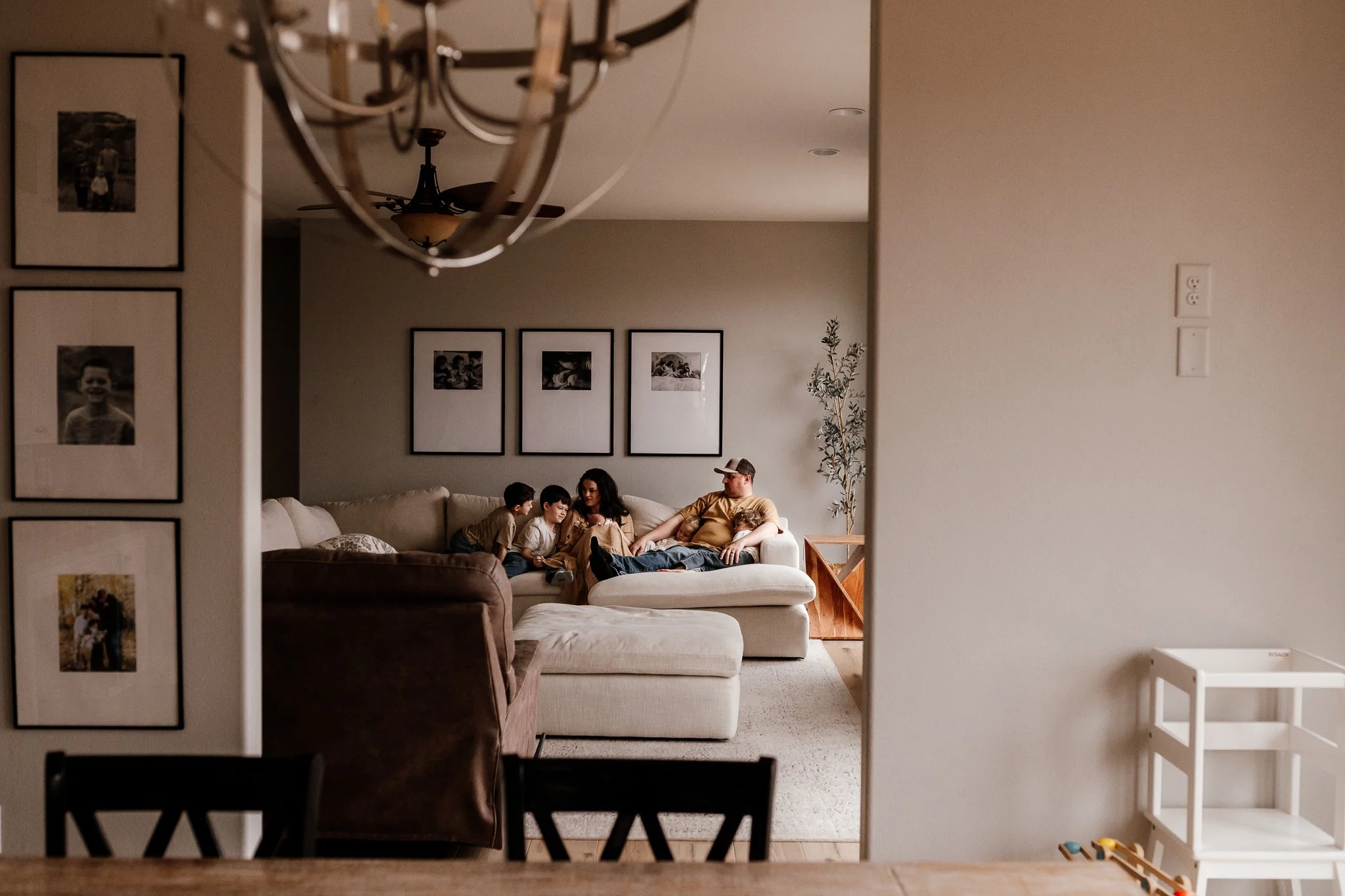 Cozy, connected family moment during in-home newborn photo shoot in North Dakota