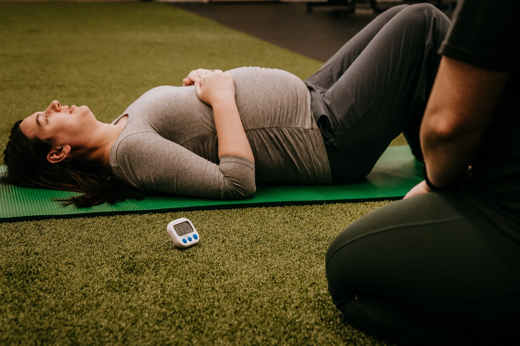 Pregnant woman working with a prenatal fitness specialist in Bismarck, North Dakota