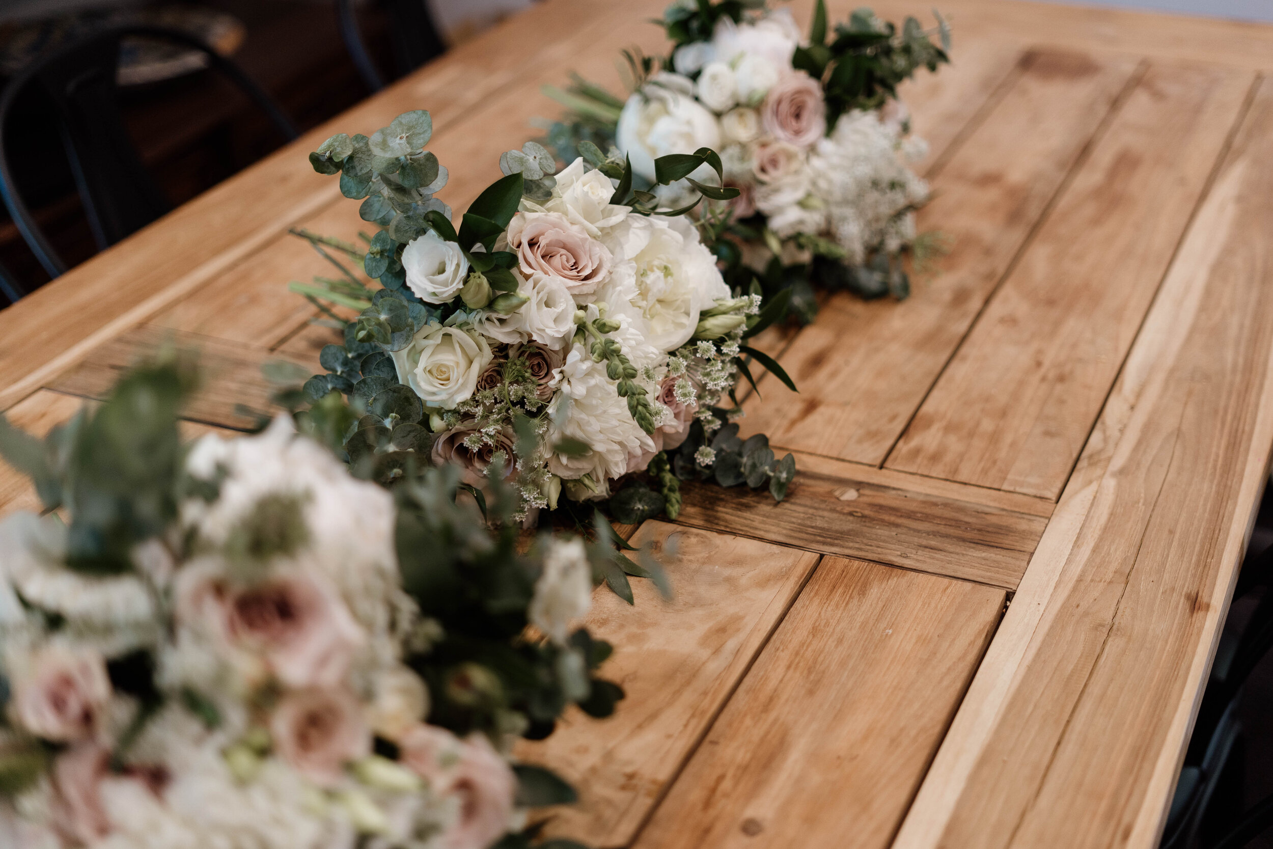 Wedding flowers on head table - white and pink roses