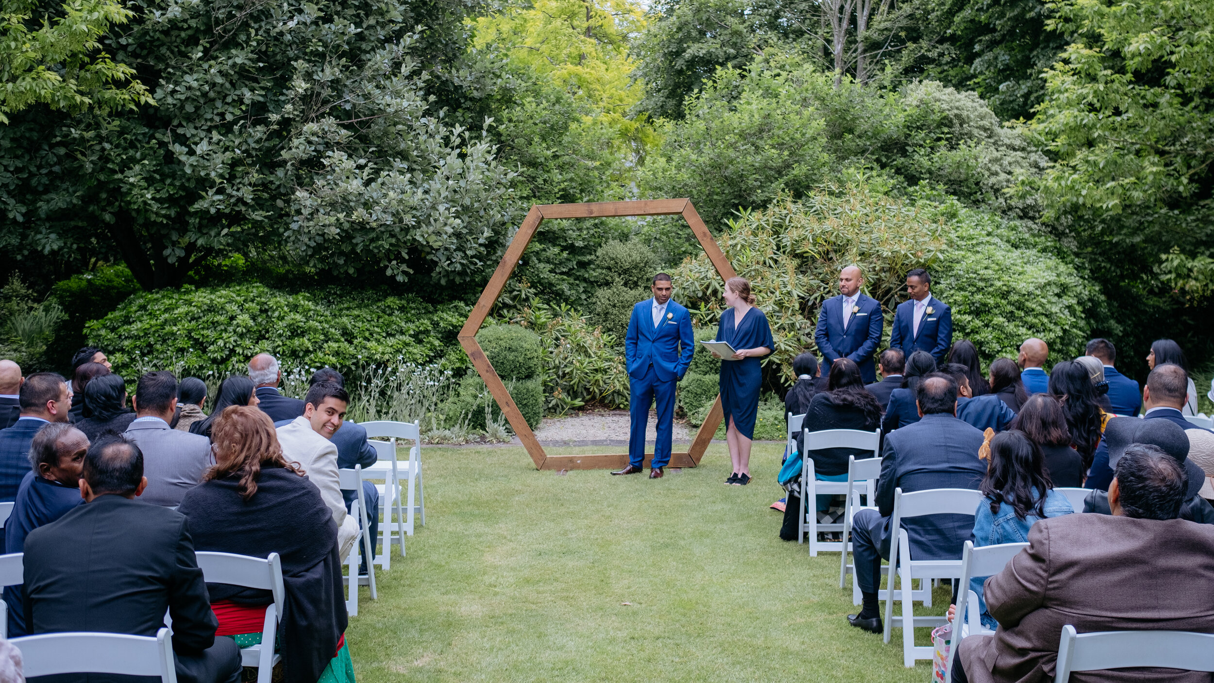 Celebrant and Groom in position at front of aisle