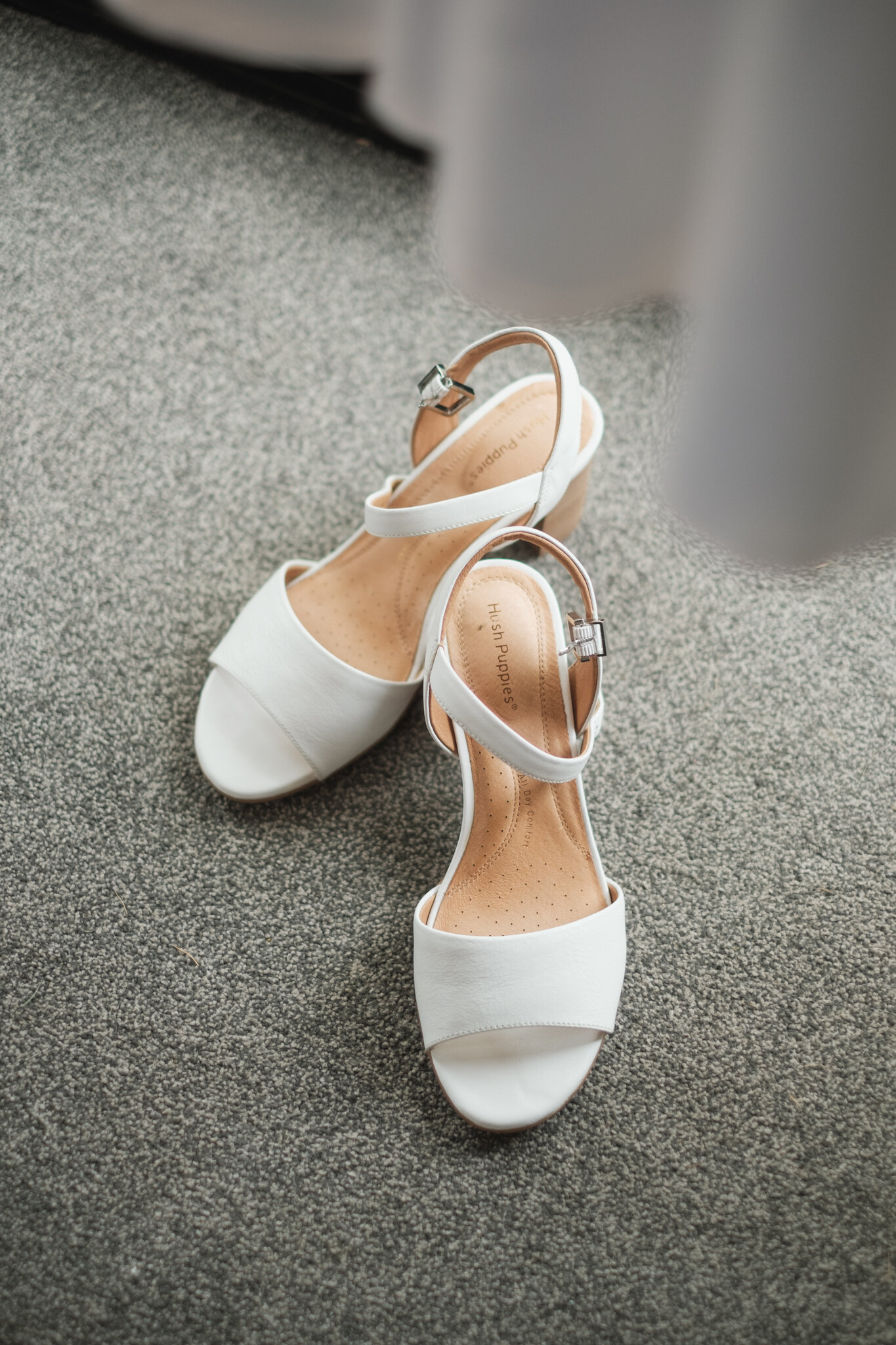 Bride's white wedding shoes with small heel