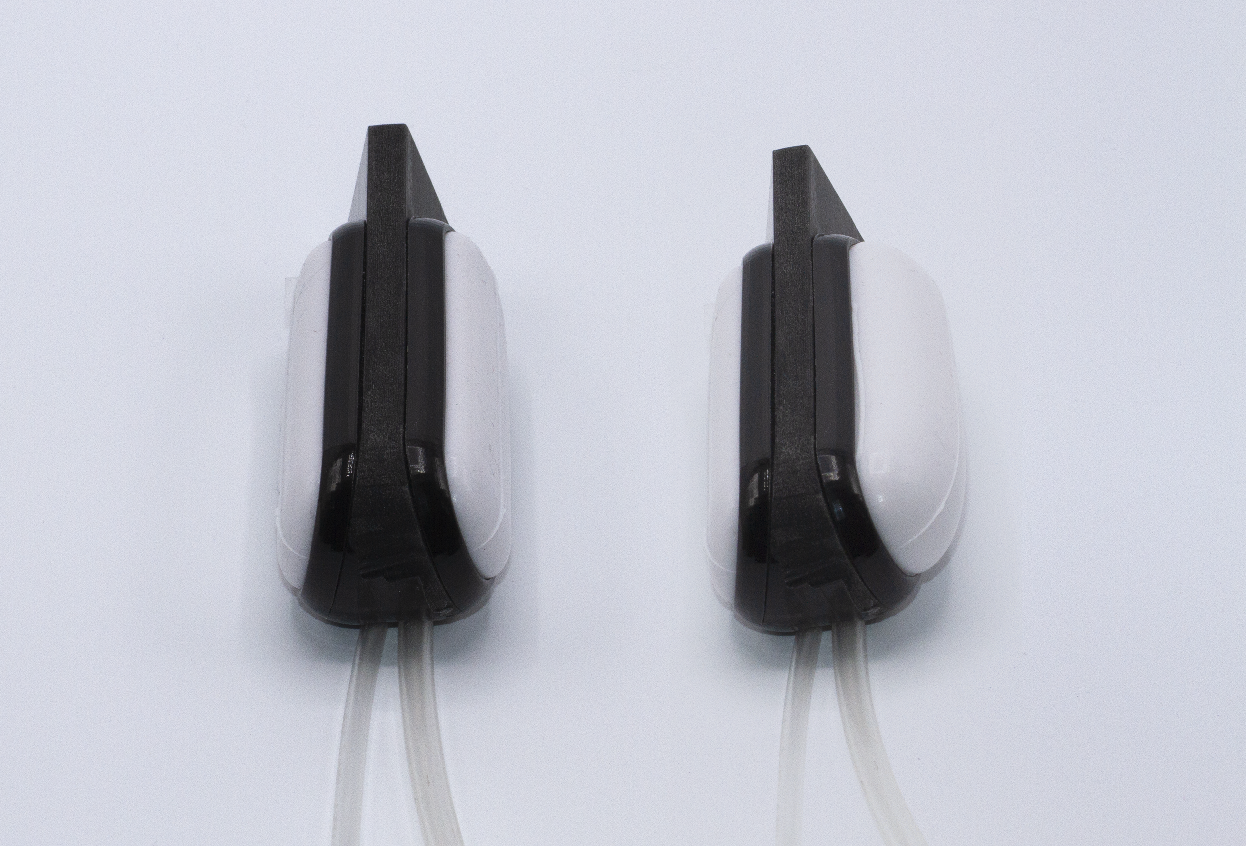 Side by side of the controller. On the left it is shown deflated, and on the right it is shown with the right chamber inflated.