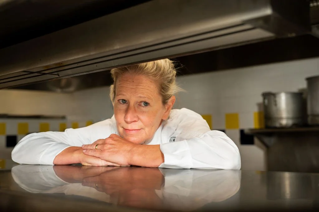 Professional environmental portrait of a chef in a commercial kitchen at Johnson & Wales University in Charlotte, NC.