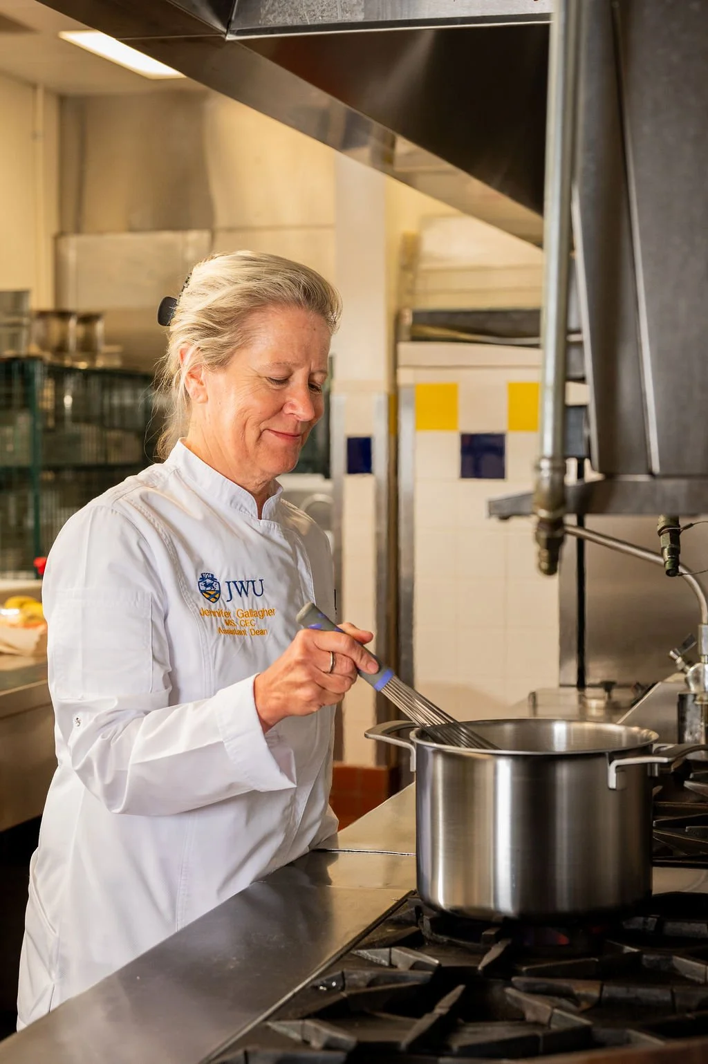 Professional environmental portrait of a chef in a commercial kitchen at Johnson & Wales University in Charlotte, NC.