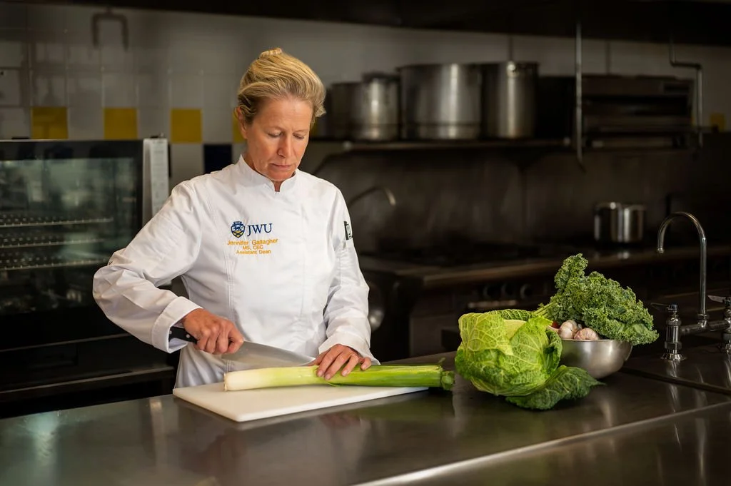 Professional environmental portrait of a chef in a commercial kitchen at Johnson & Wales University in Charlotte, NC.