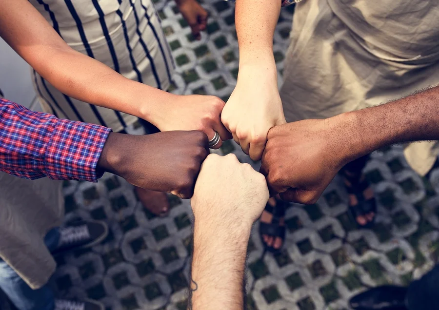 bigstock-Diversity-hands-fist-bump-for-182667208.jpg