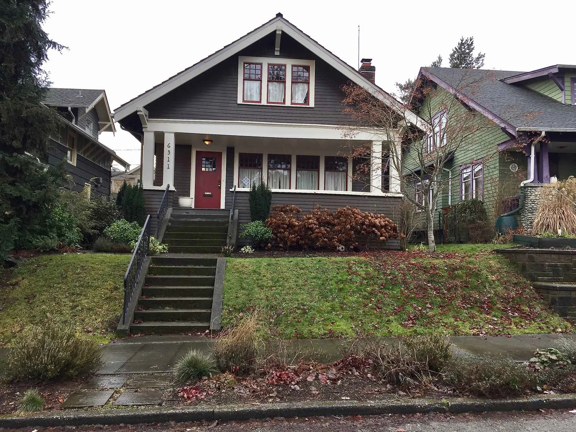 BEFORE: SLOPE PREVENTS FUNCTIONAL USE OF FRONT YARD