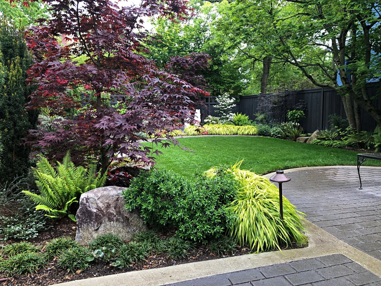 WOODLAND THEME IS CARRIED THROUGHOUT GARDEN TO CREATE CALM