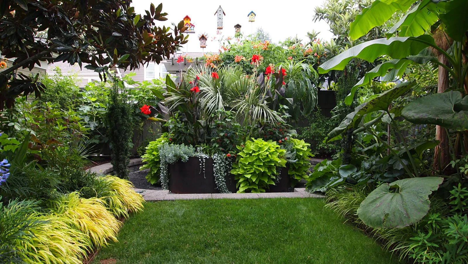 HARDY TROPICAL CENTERPIECE WITH BIRDHOUSE DISPLAY