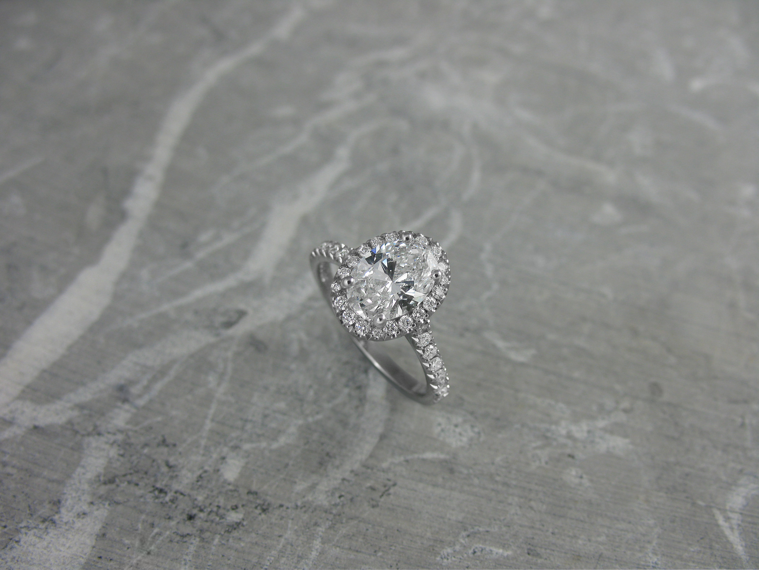 Oval diamond halo engagement ring