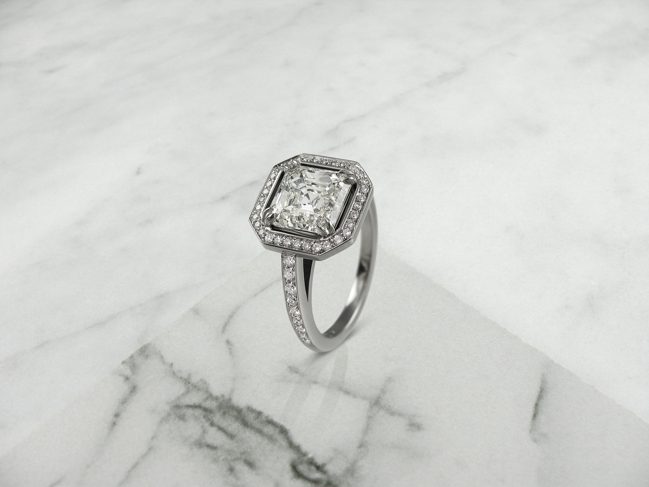 Radiant cut diamond halo engagement ring