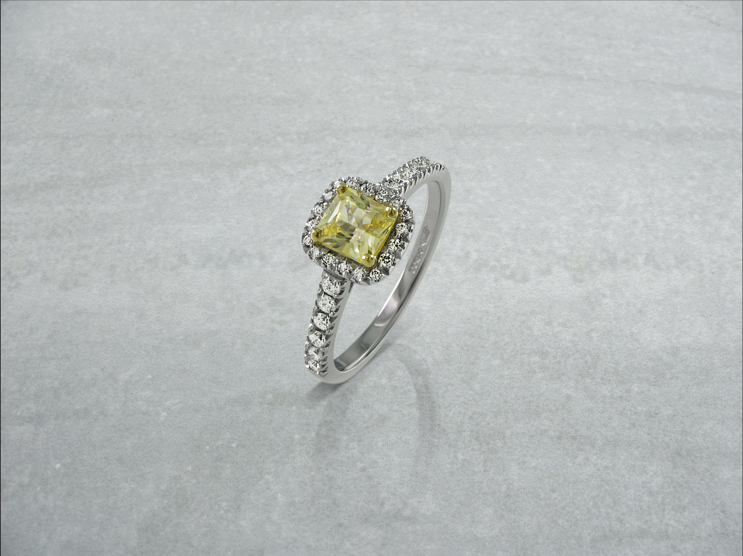 Radiant cut yellow diamond halo engagement ring with diamond band