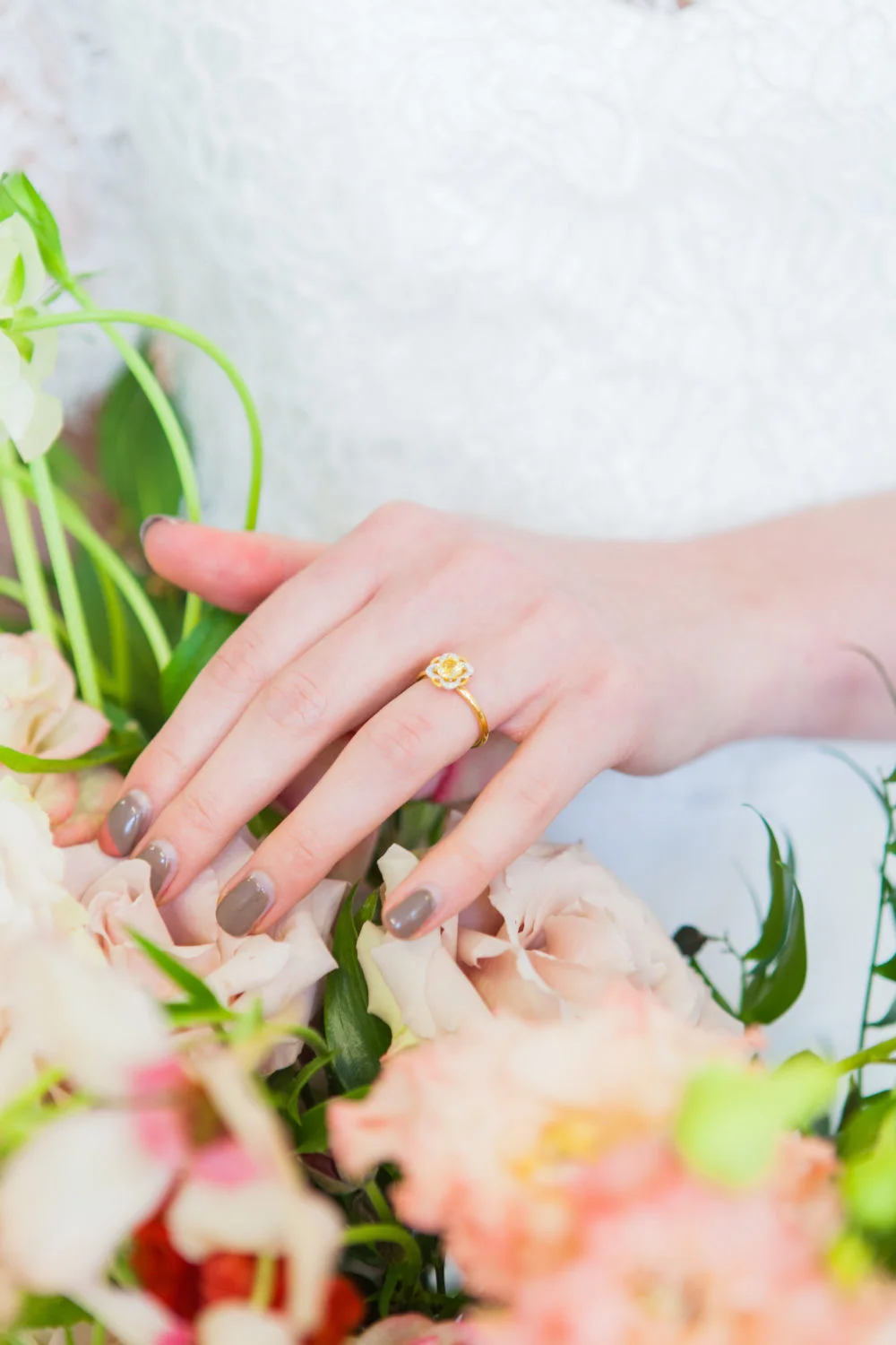 Bride's hands with floral engagement ring AmandaKarenPhotography
