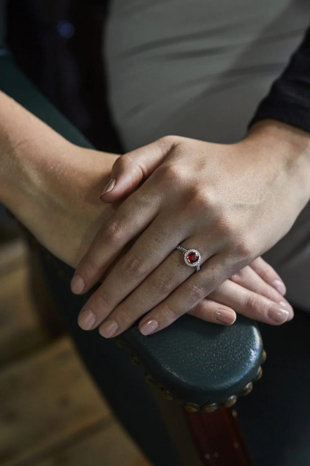 Lady's hands with coloured stone engagement ring.jpg