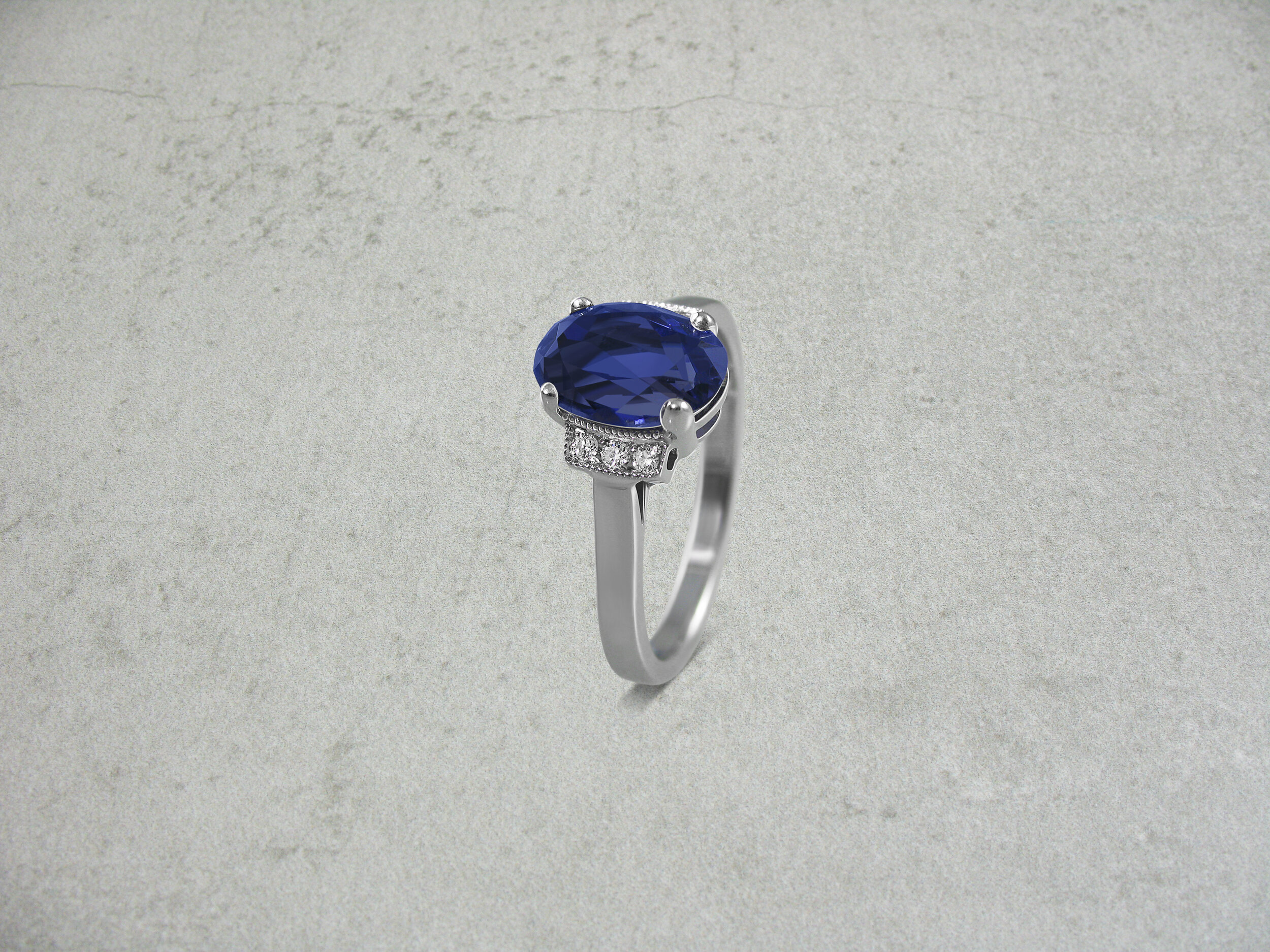 Oval sapphire and diamond engagement ring