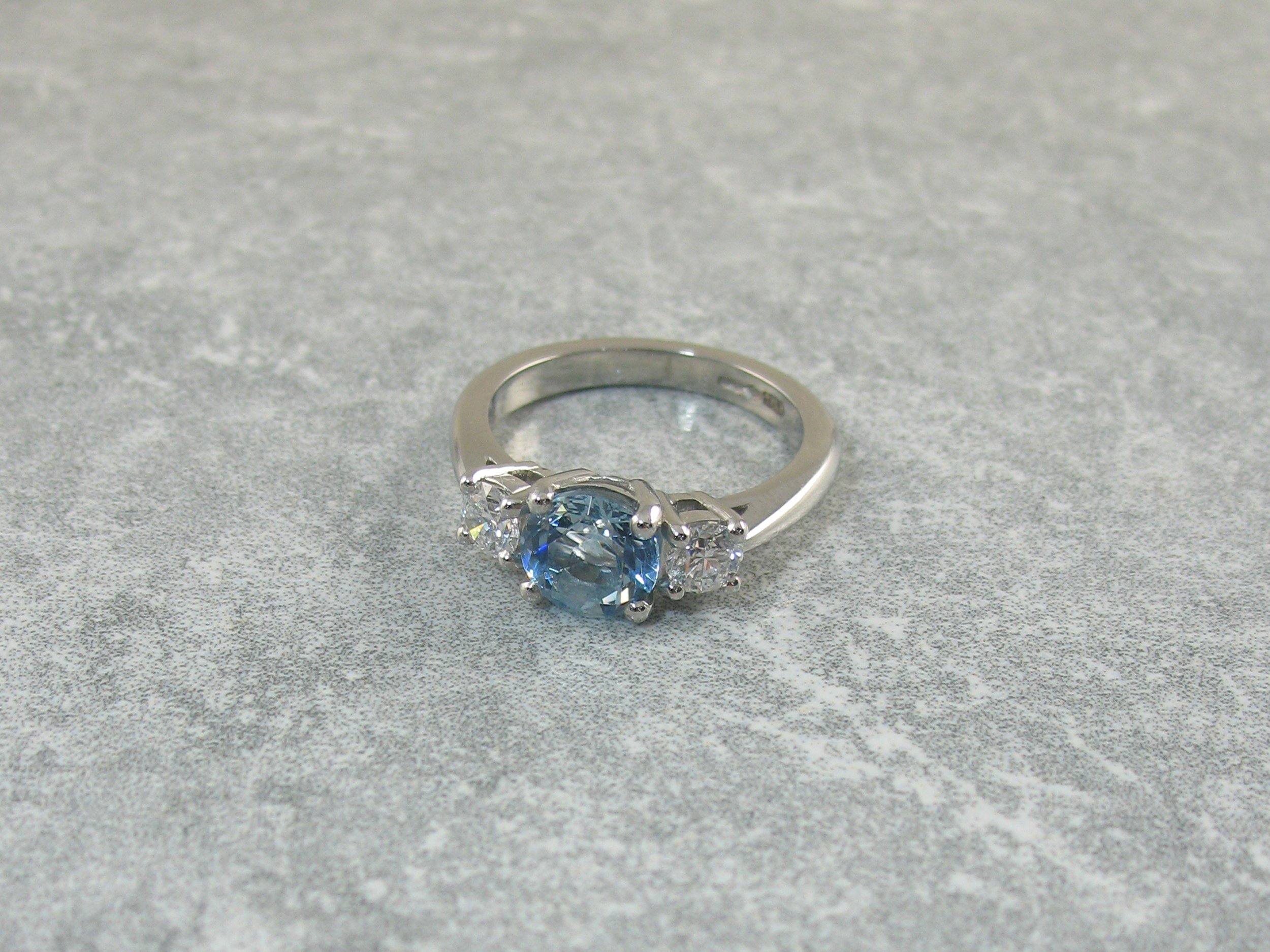 Aquamarine and diamond three stone ring