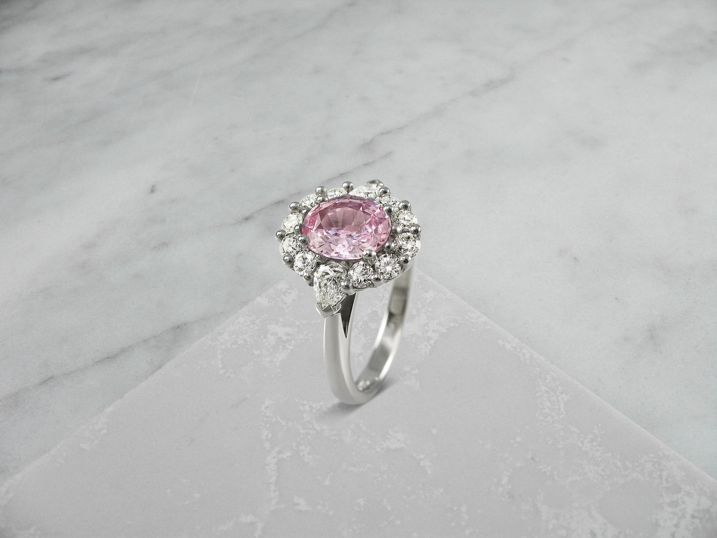 Pink sapphire cluster ring with pear shaped shoulders.jpg