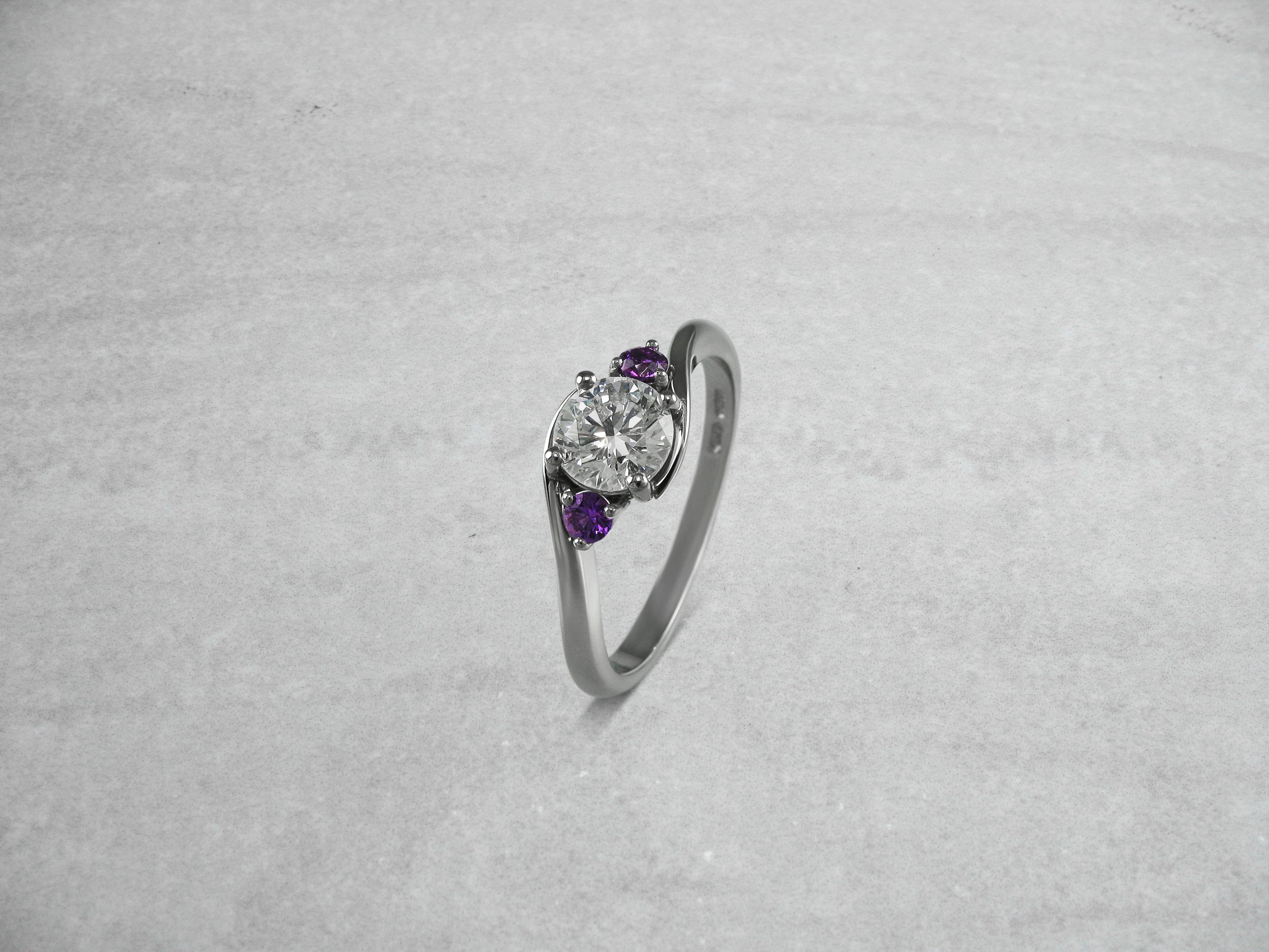 Purple sapphire and diamond engagement ring