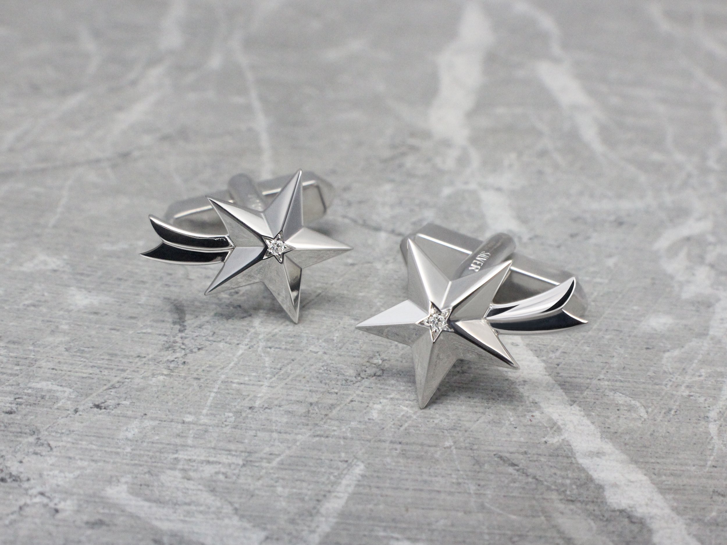 Star shaped cufflinks with diamond detail