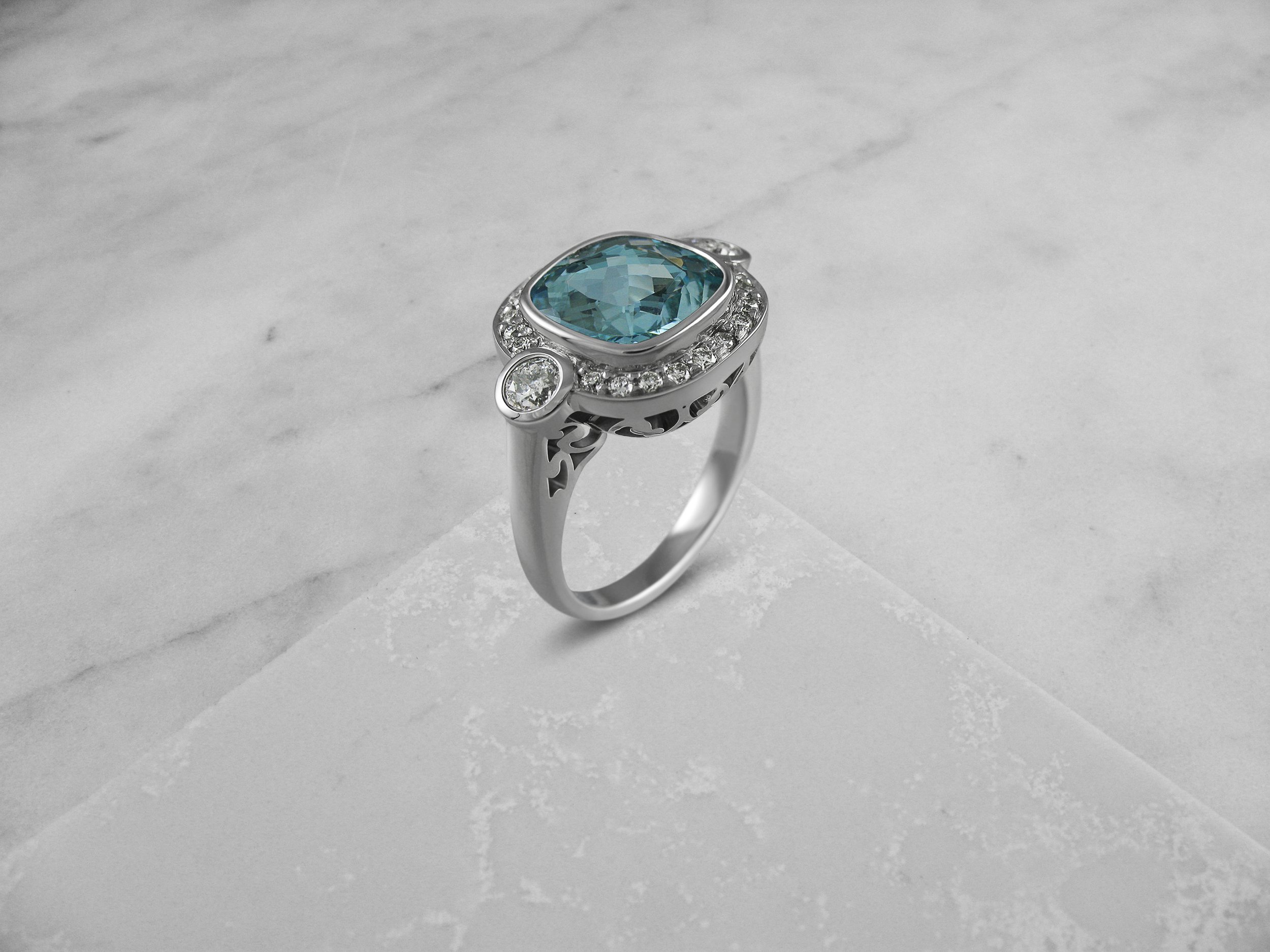 Aquamarine and Diamond Halo Ring.jpg