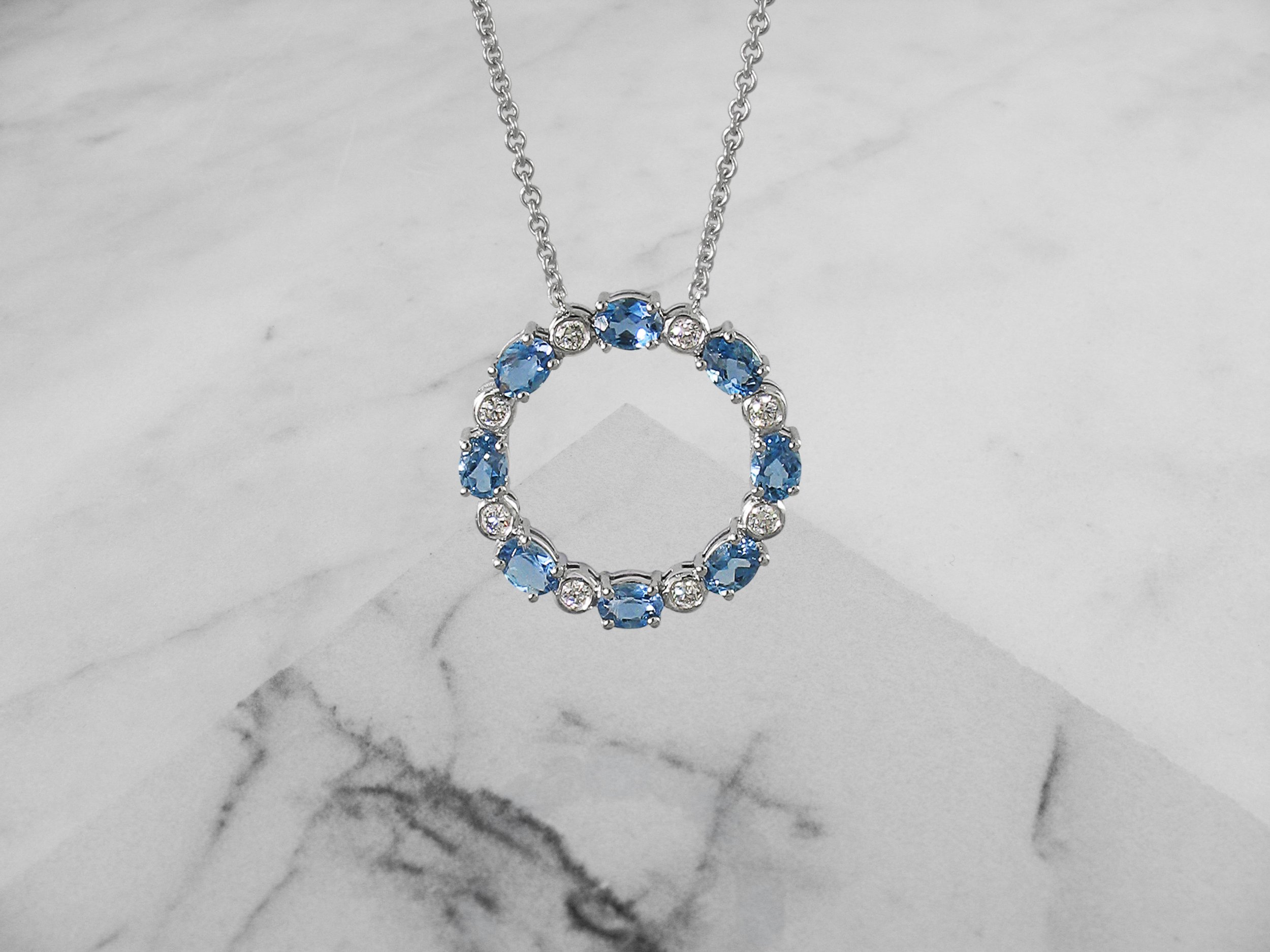 Aquamarine and diamond circle pendant