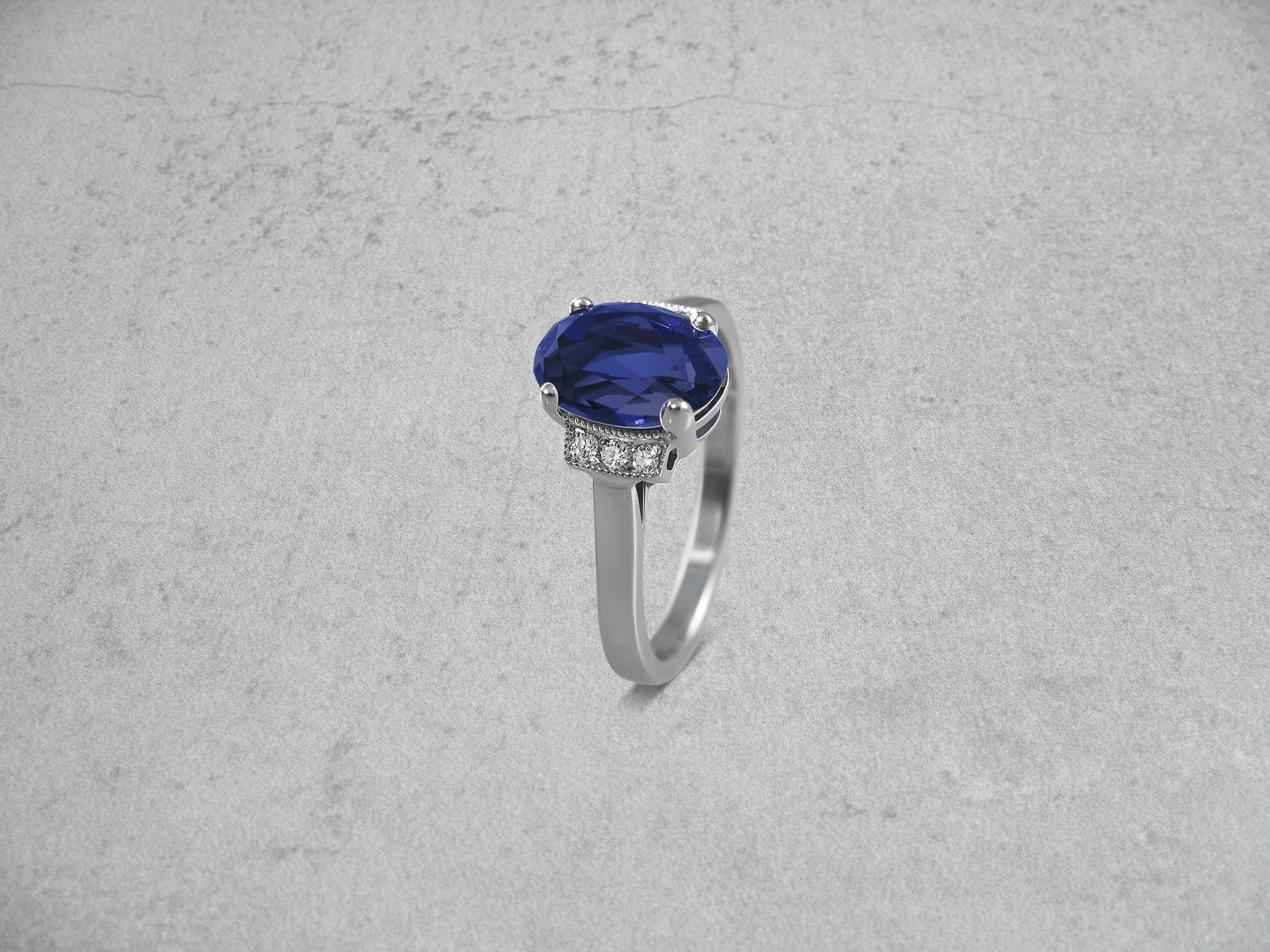 Iolite and diamond engagement ring
