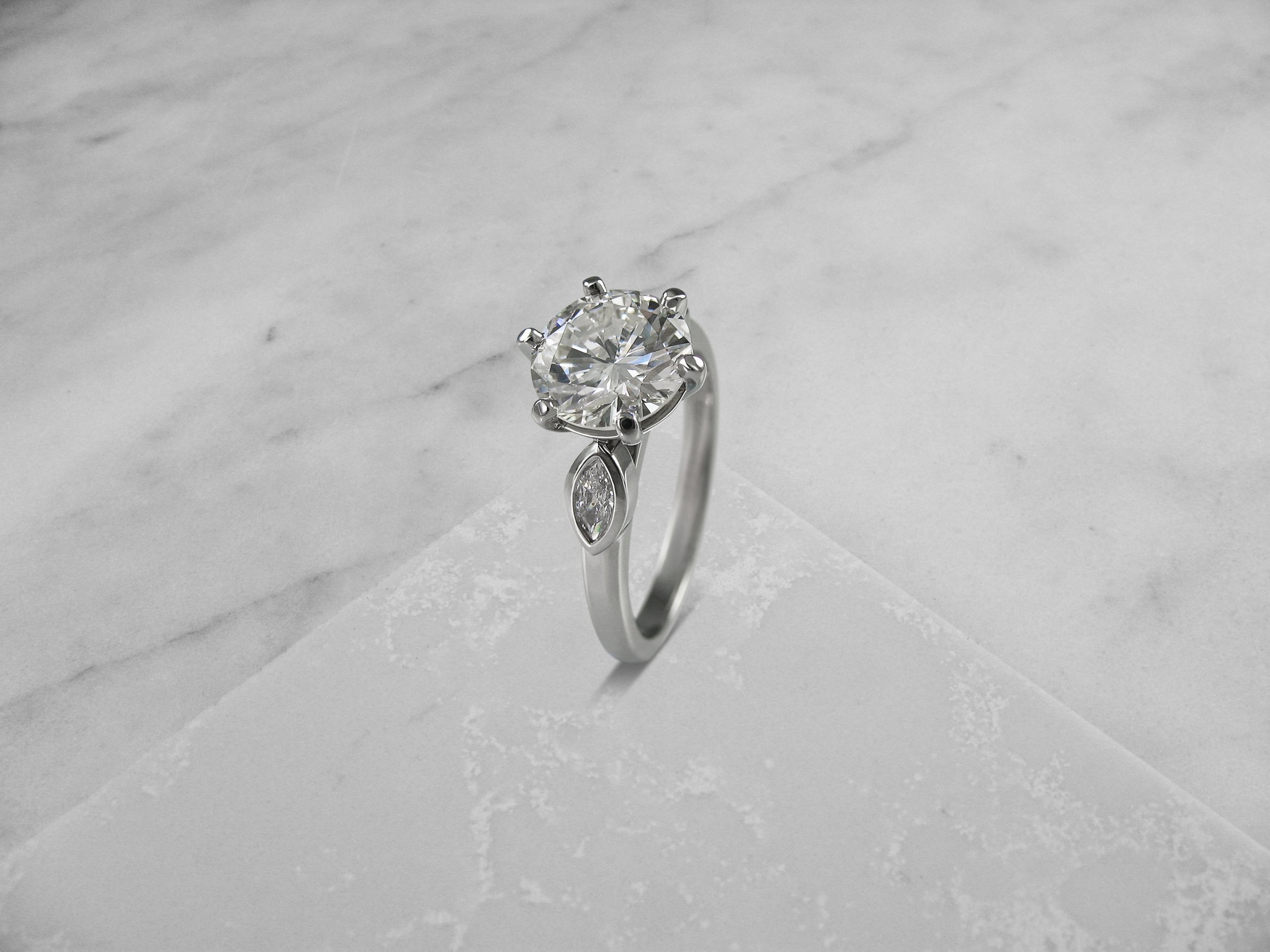 Marquise diamond shoulder engagement ring