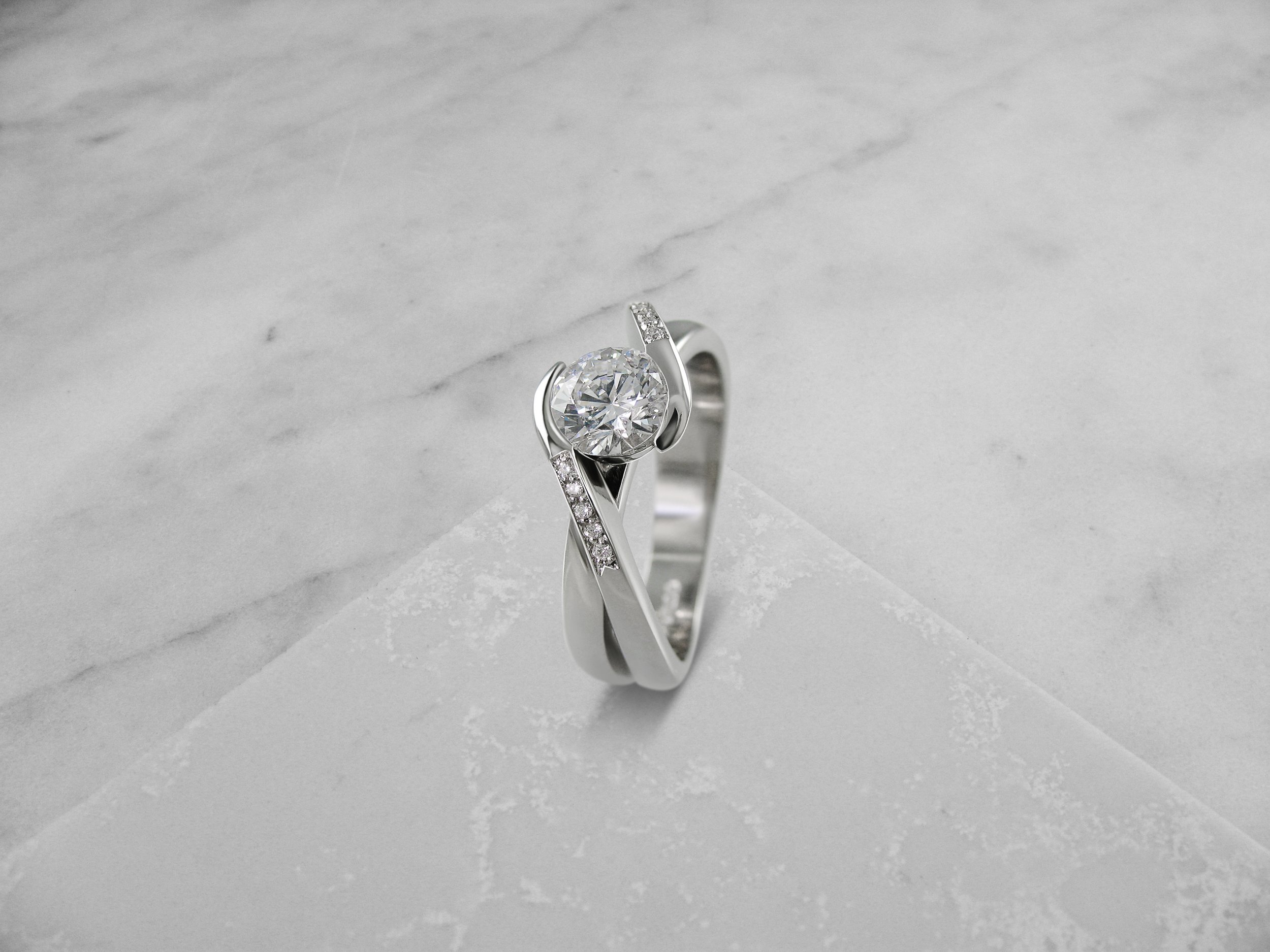 Cross over diamond engagement ring