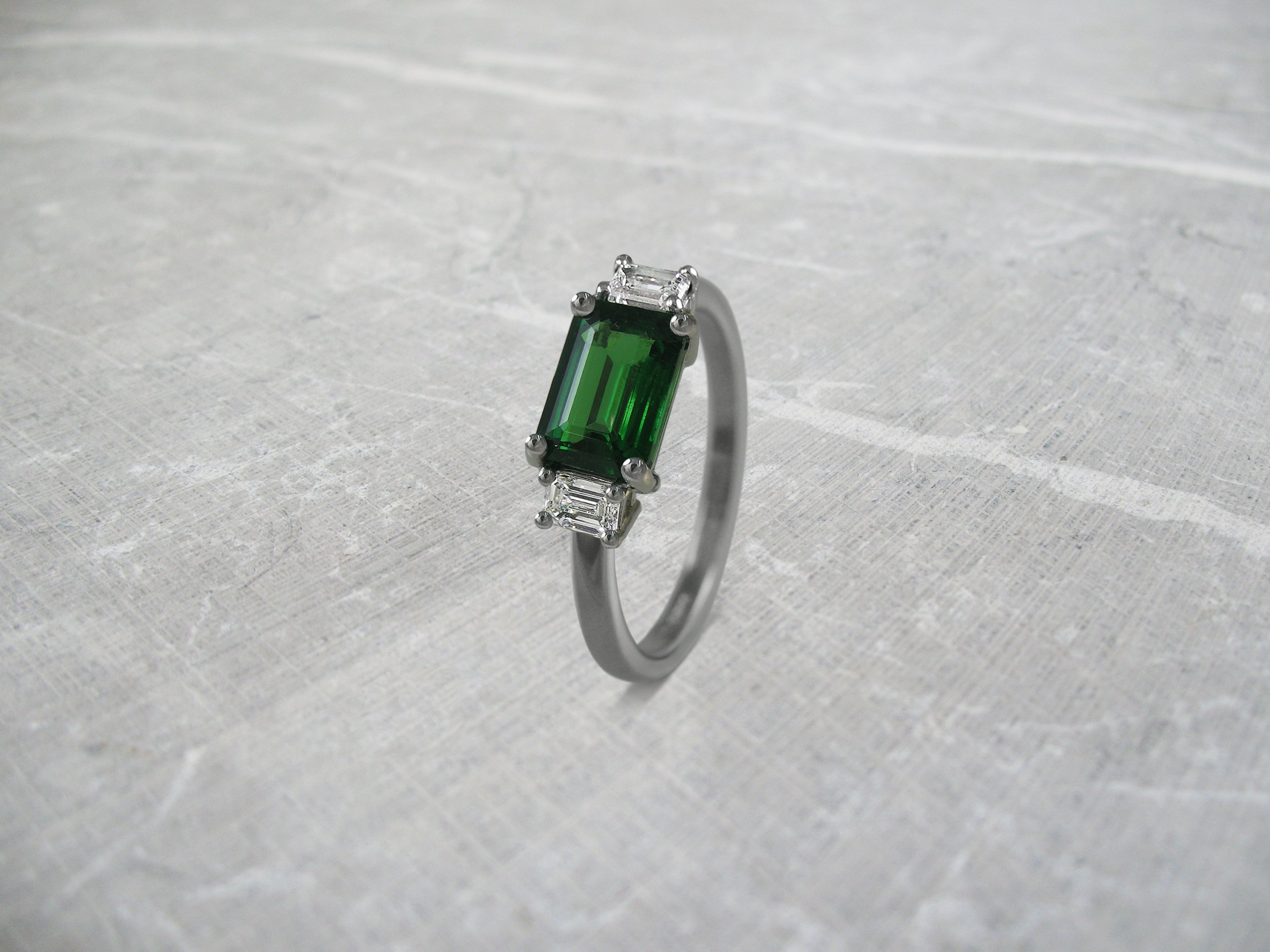 Contemporary tsavorite and diamond engagement ring