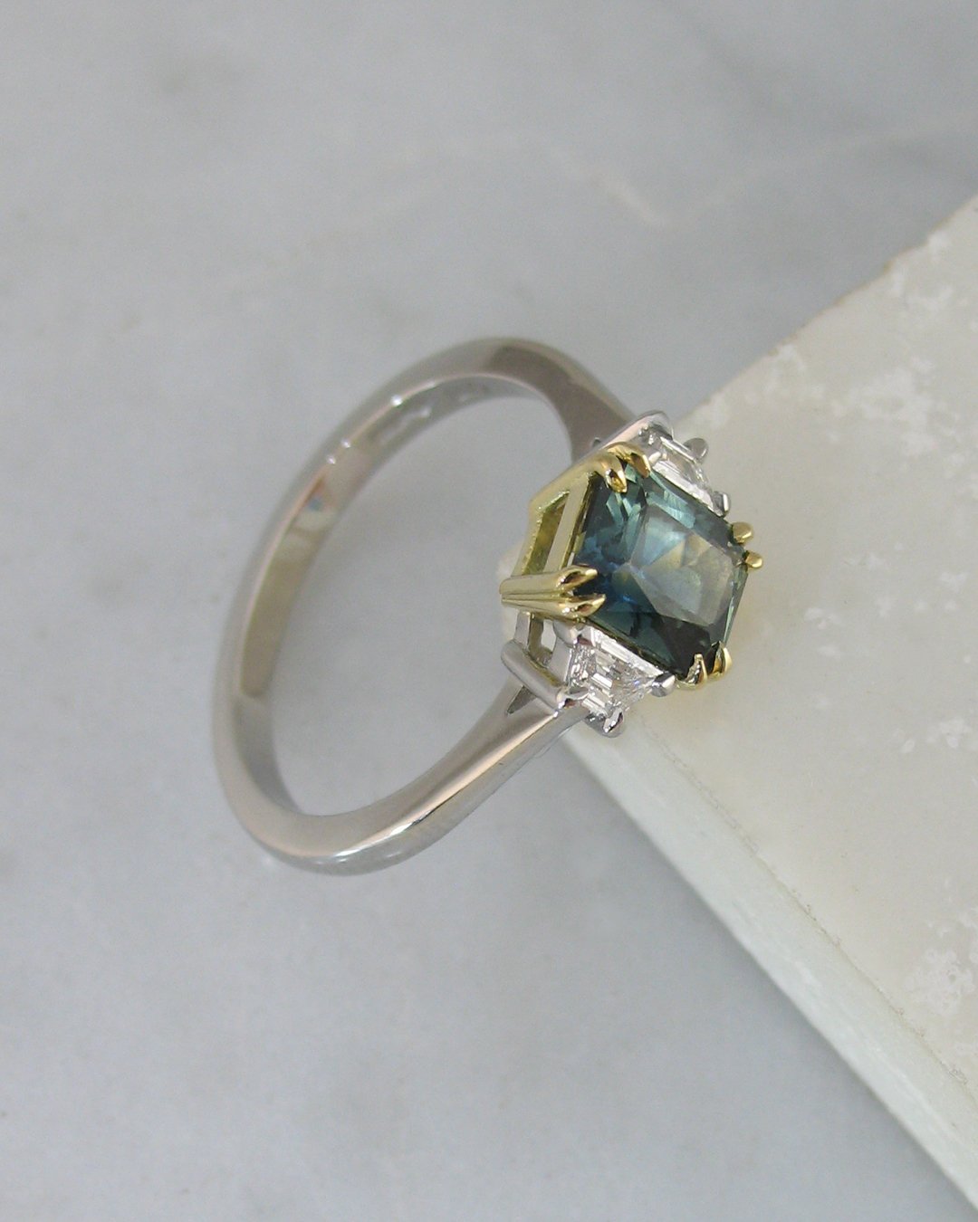 A beautiful teal sapphire engagement ring