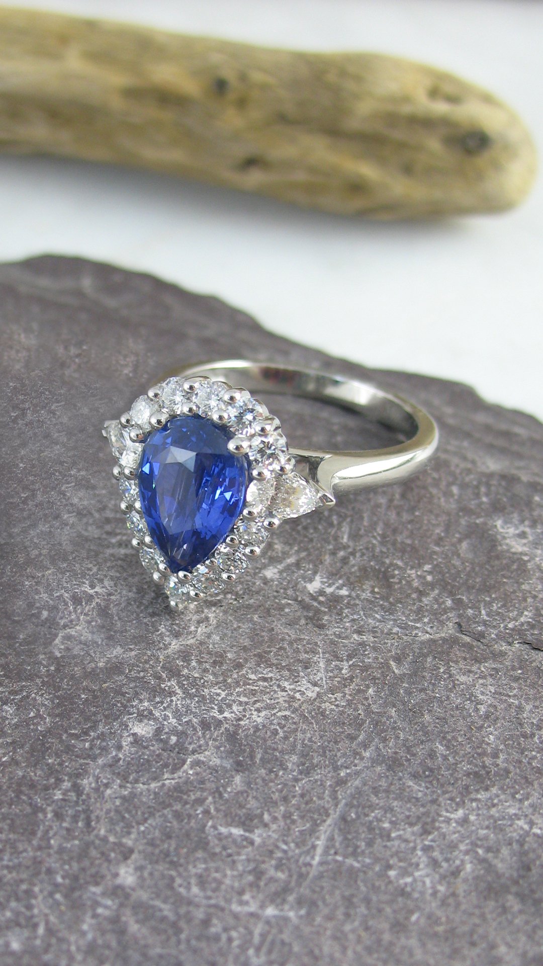An exquisite pear-shaped sapphire halo ring