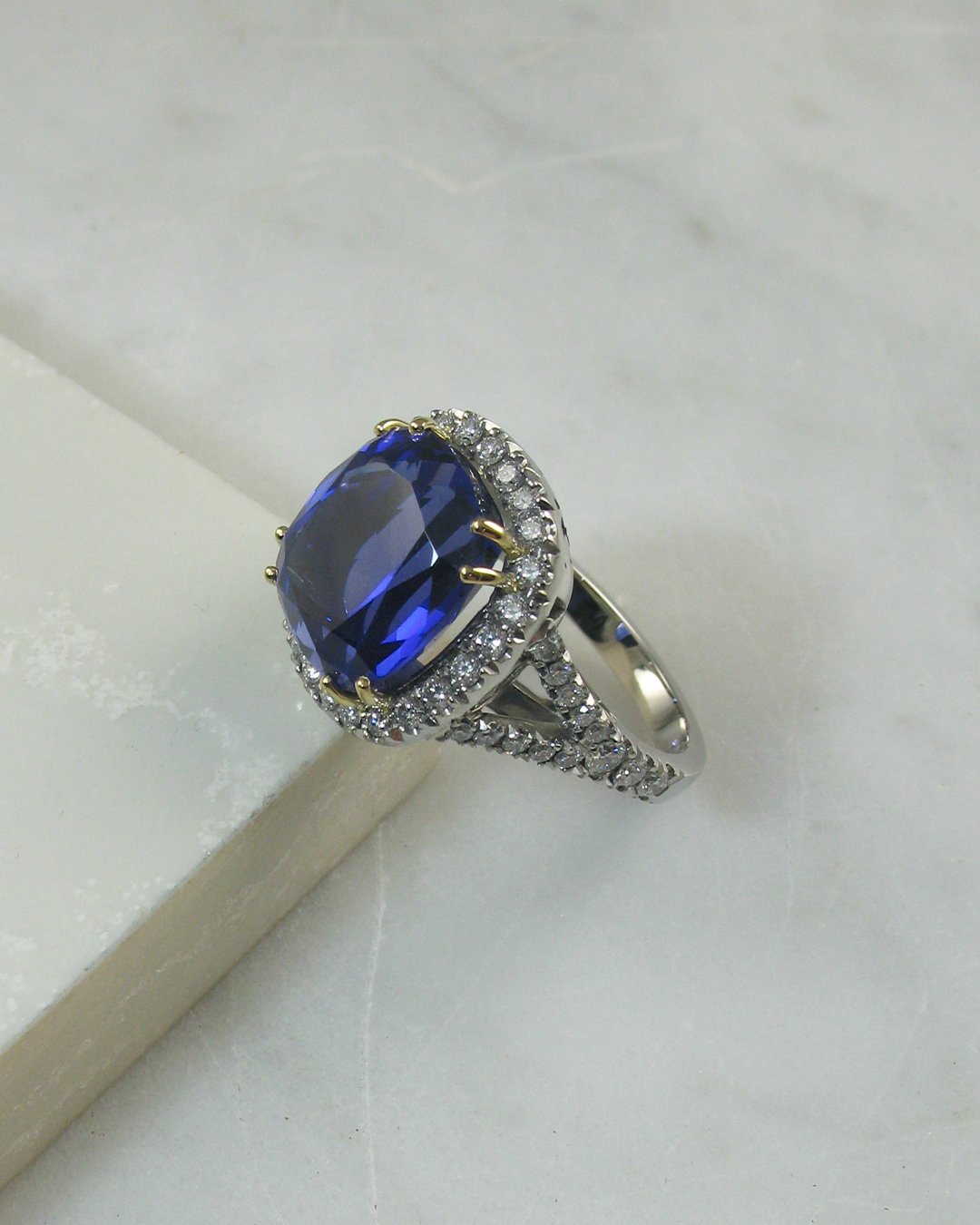  A gorgeous split shoulder cushion cut bespoke sapphire ring